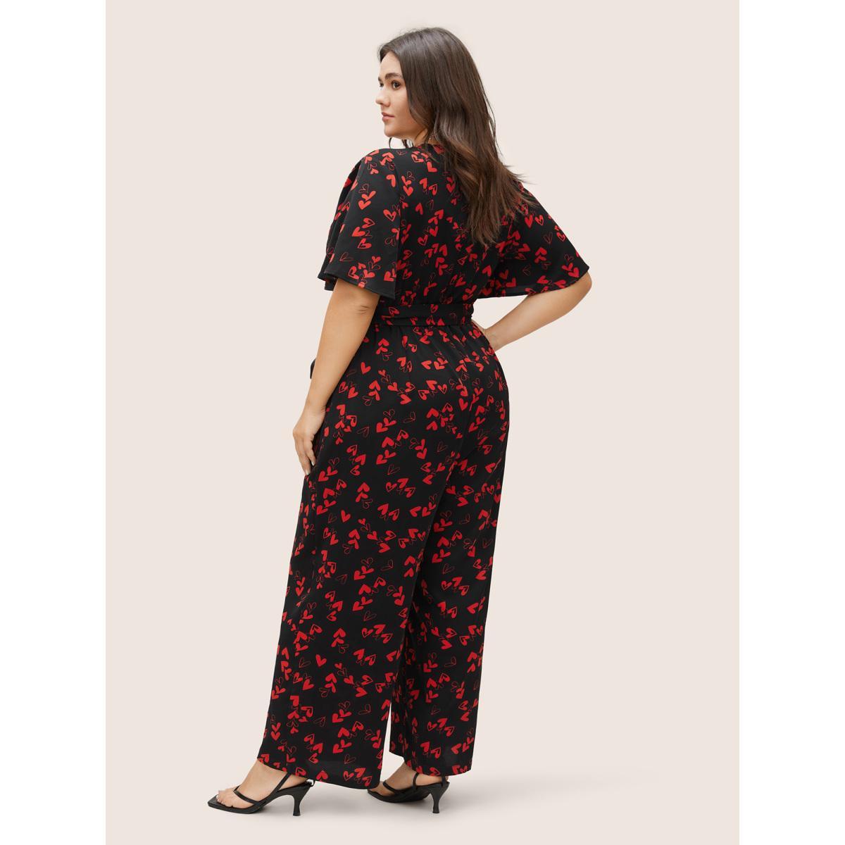 Plus Size Black Heart Print Pocket Belted Jumpsuit Women Elegant Short sleeve V-neck Everyday Loose Jumpsuits BloomChic 26/4X Product Image