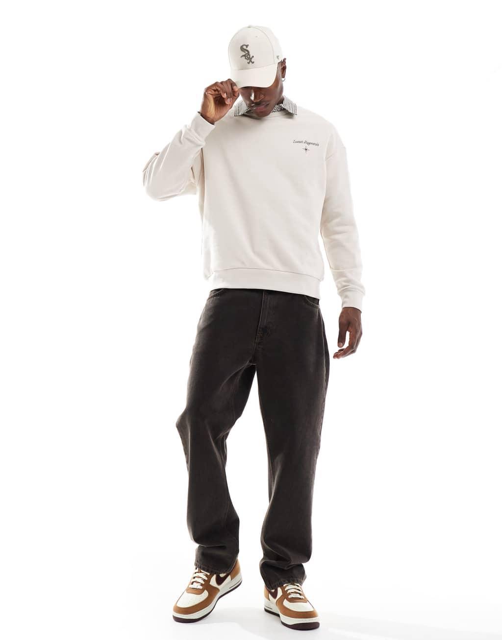 Jack & Jones drop shoulder crew neck sweat with celestial back print in beige Product Image