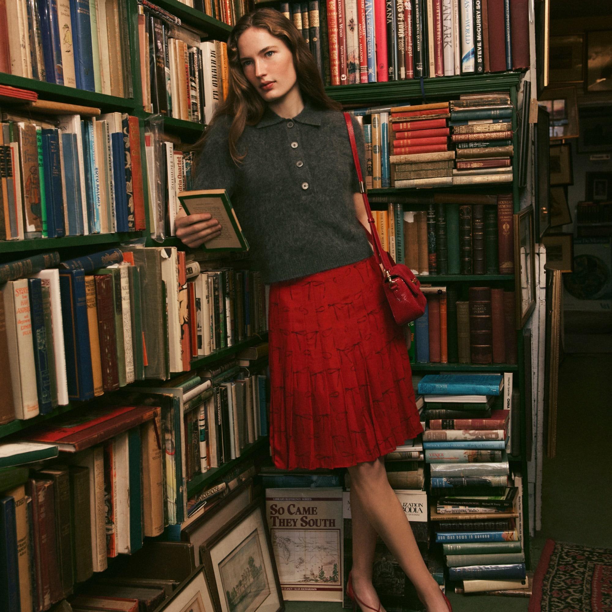 Pleated knee-length skirt in bow-print viscose chiffon Product Image