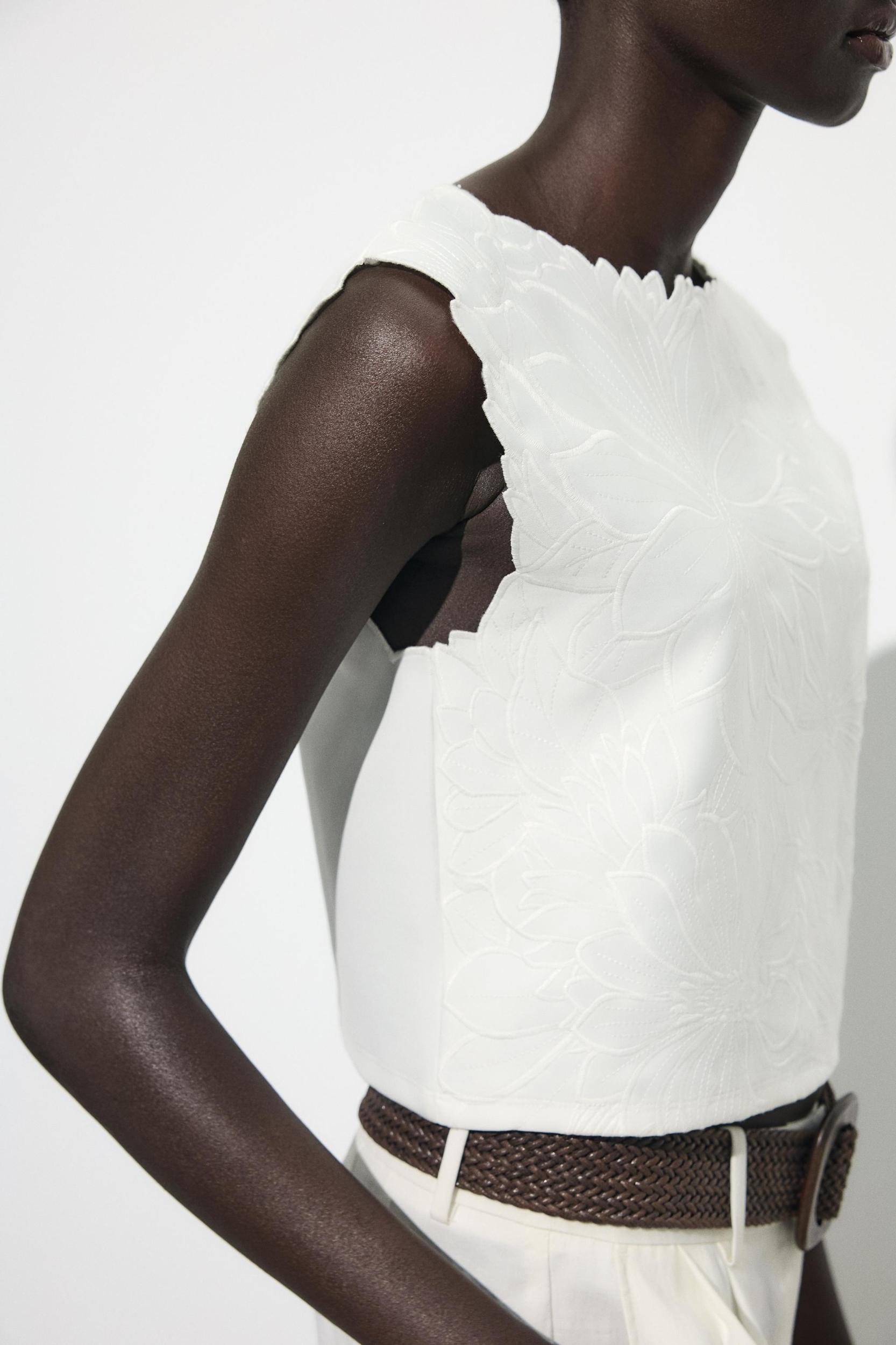 EMBROIDERED INTERLOCK TOP Product Image