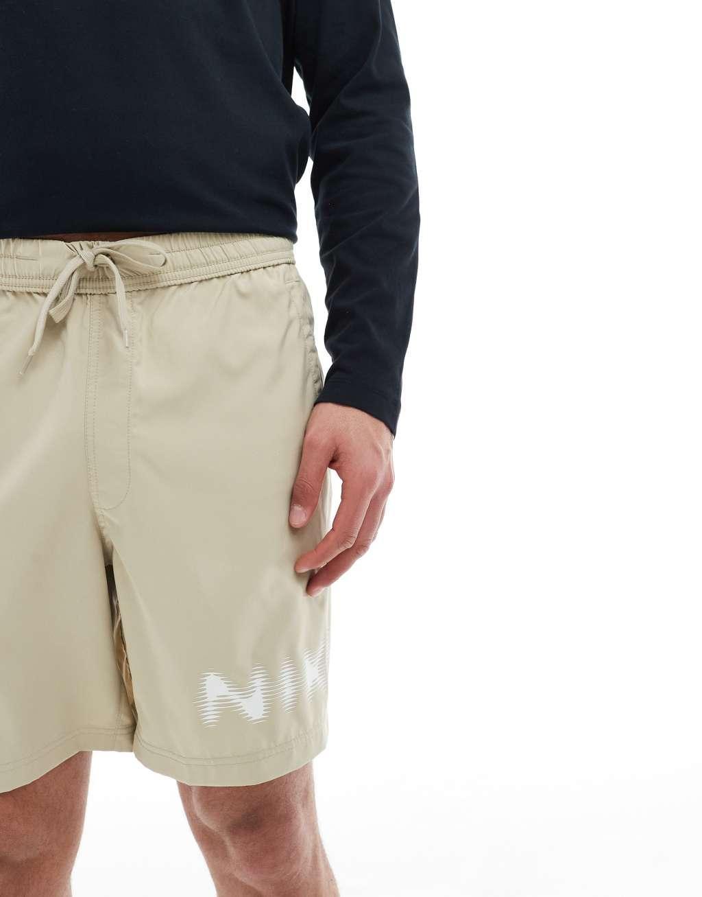 Nike Training blurred swoosh graphic 7 inch shorts in beige Product Image