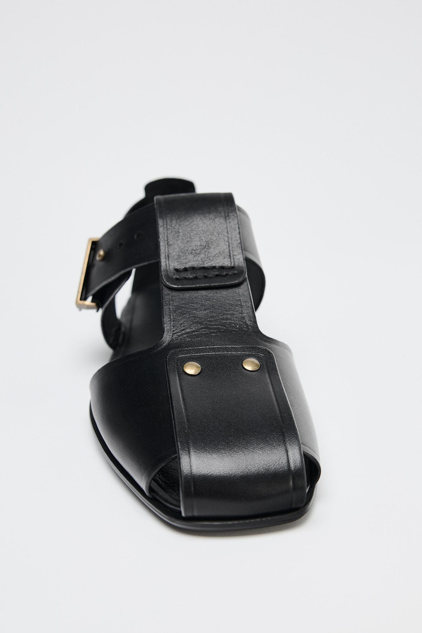 LEATHER STUDDED CAGE SANDALS Product Image