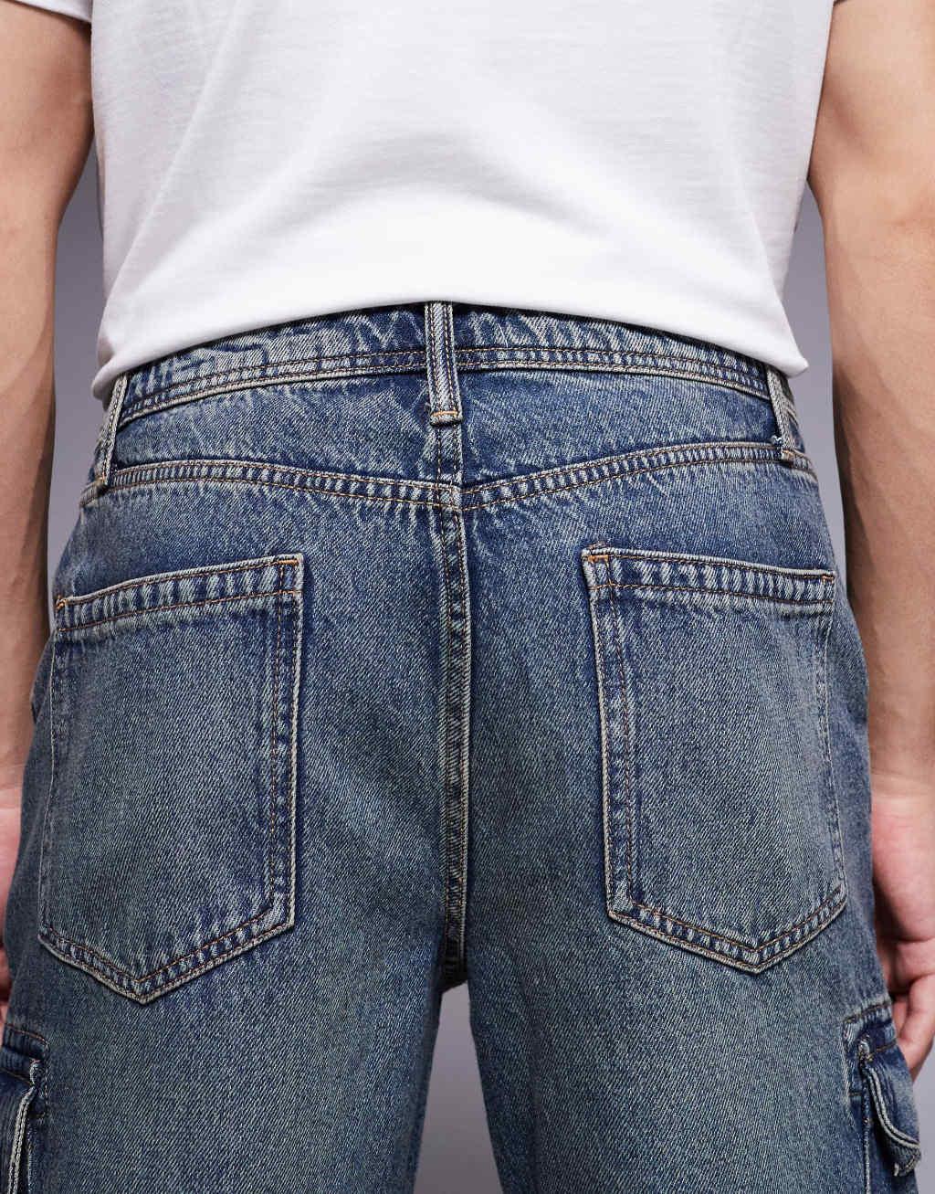 ASOS DESIGN straight leg jeans with cargo detail in mid wash blue Product Image