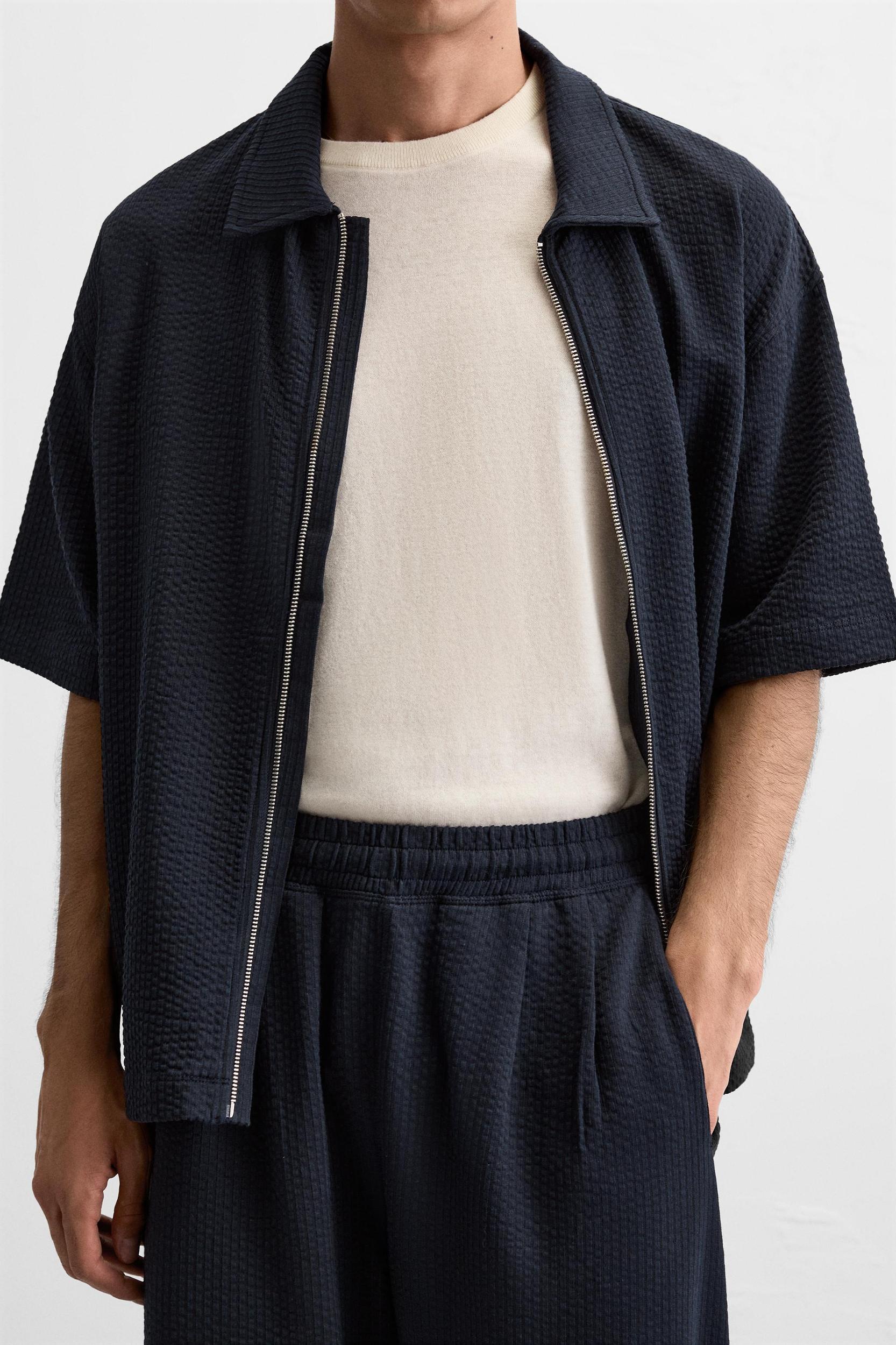 PLEATED SEERSUCKER PANTS Product Image