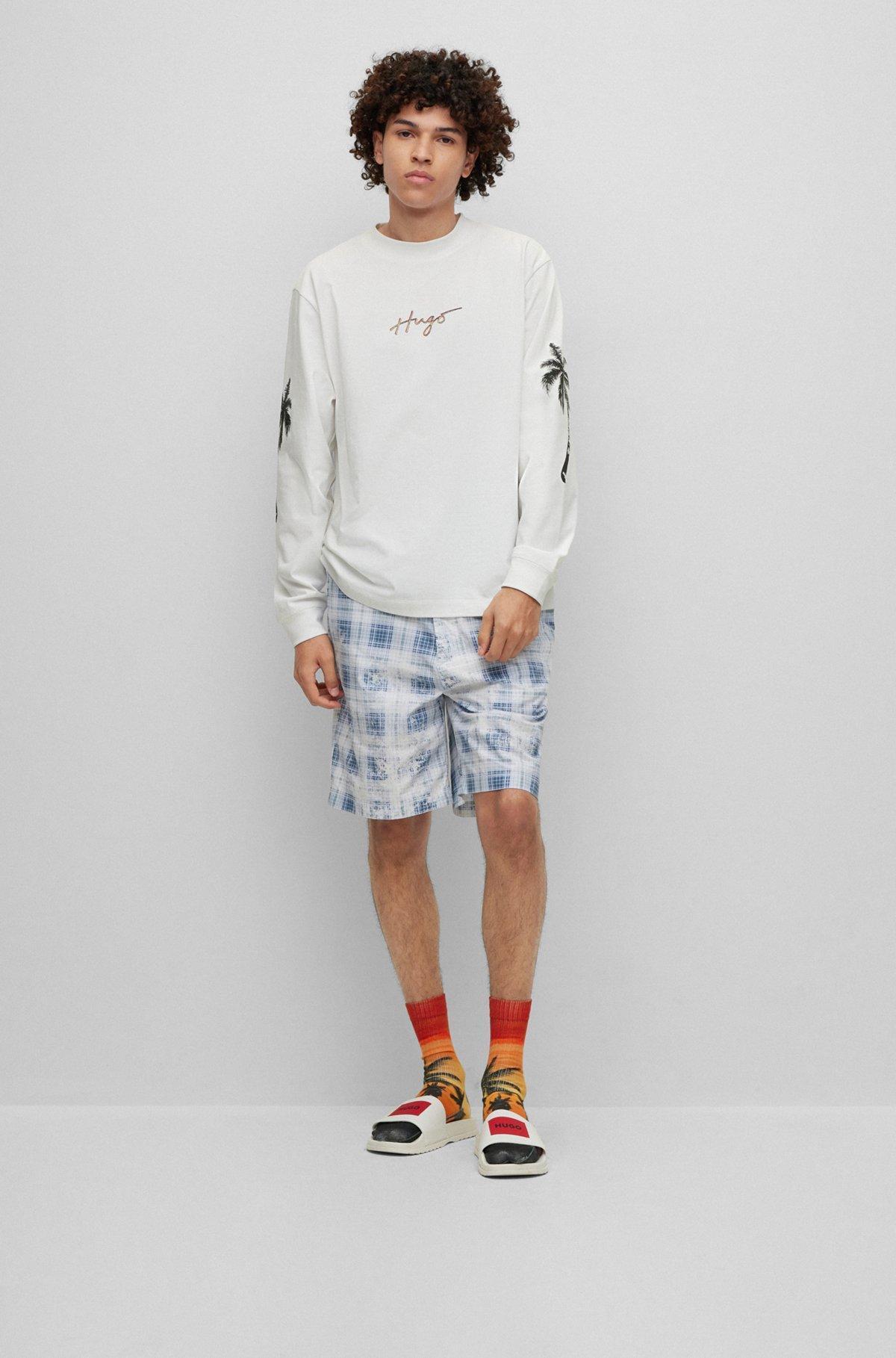 Cotton-jersey T-shirt with palm-tree artwork and branding Product Image