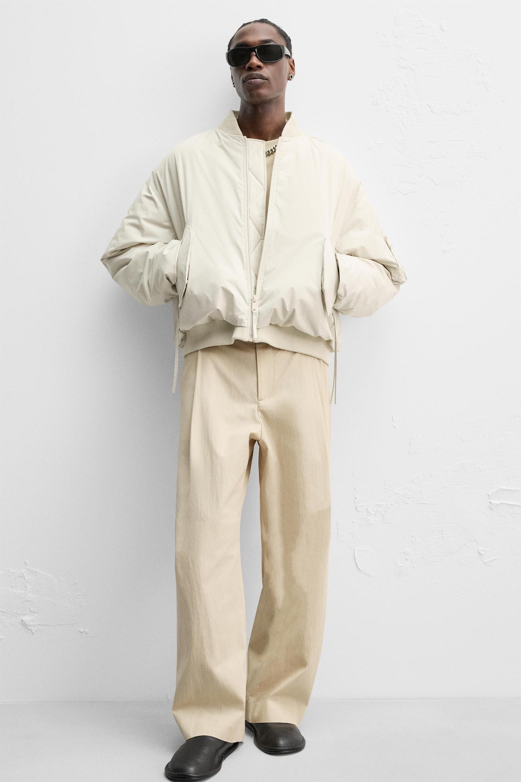 LIMITED EDITION RELAXED FIT PLEATED PANTS Product Image