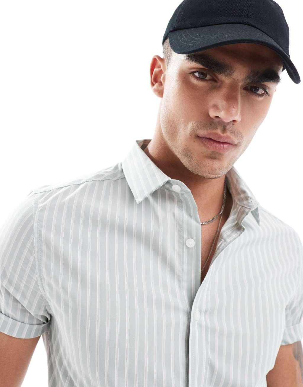 ASOS DESIGN skinny fit stripe work shirt with roll sleeves in light green Product Image