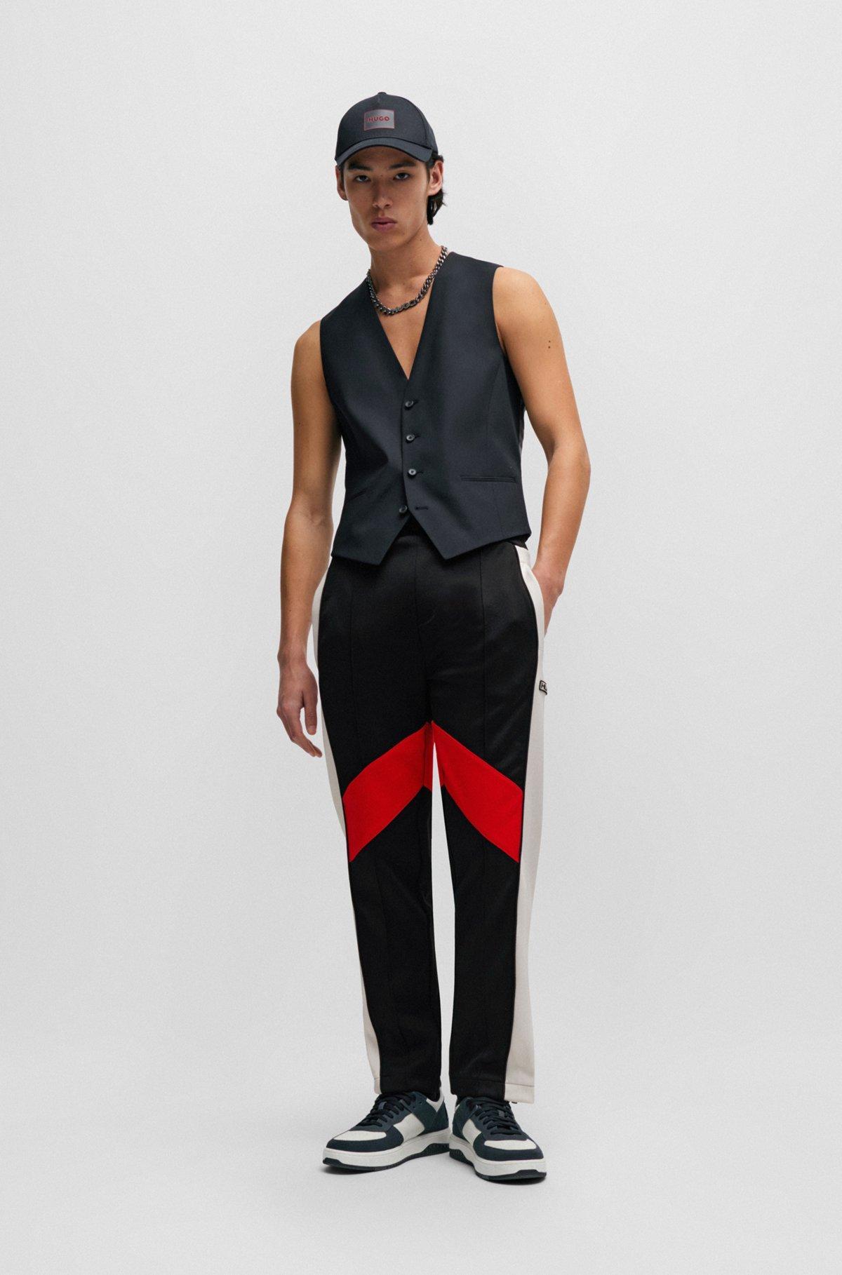 Relaxed-fit tracksuit bottoms with color-blocking Product Image