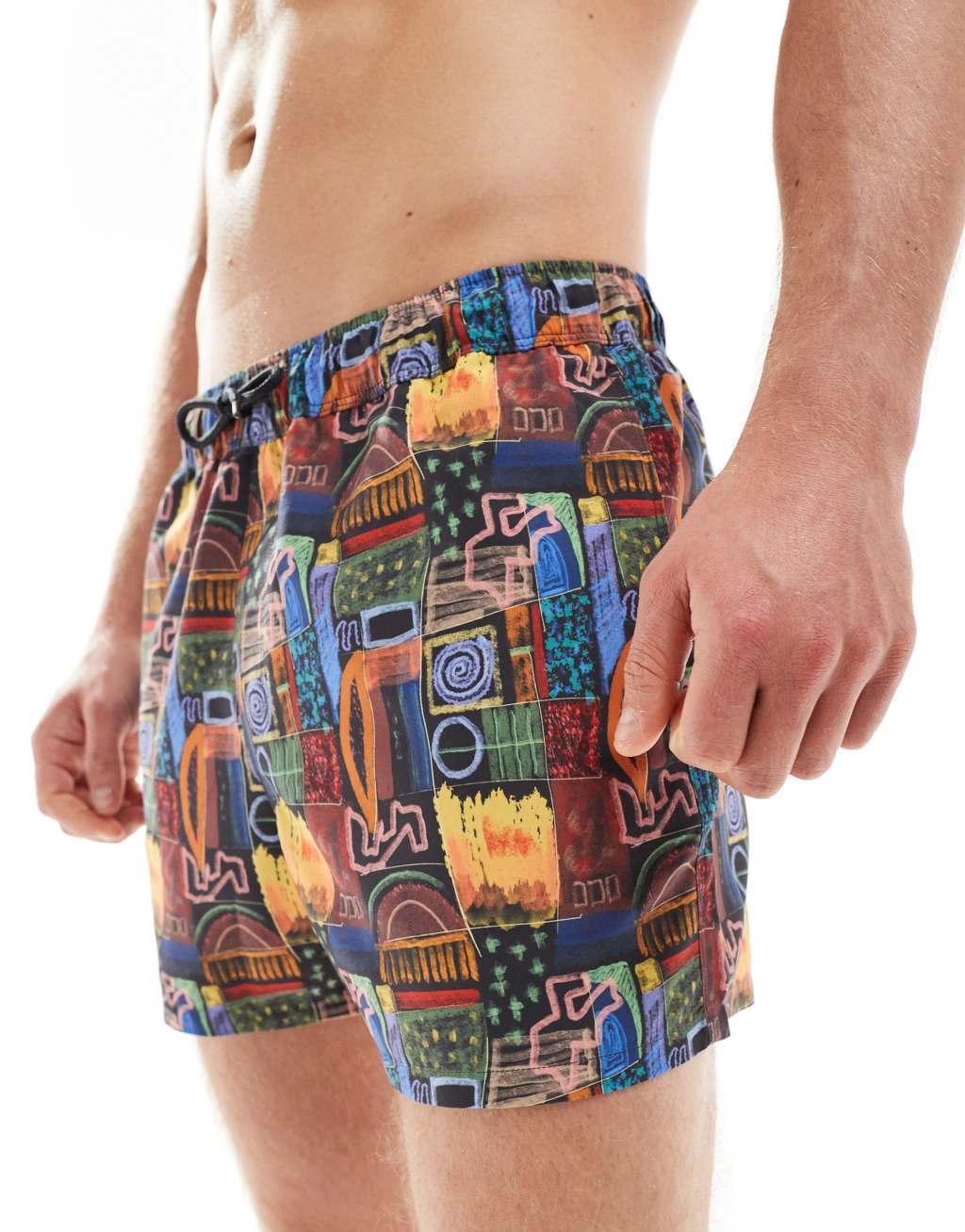 ASOS DESIGN swim shorts in short length in black print Product Image
