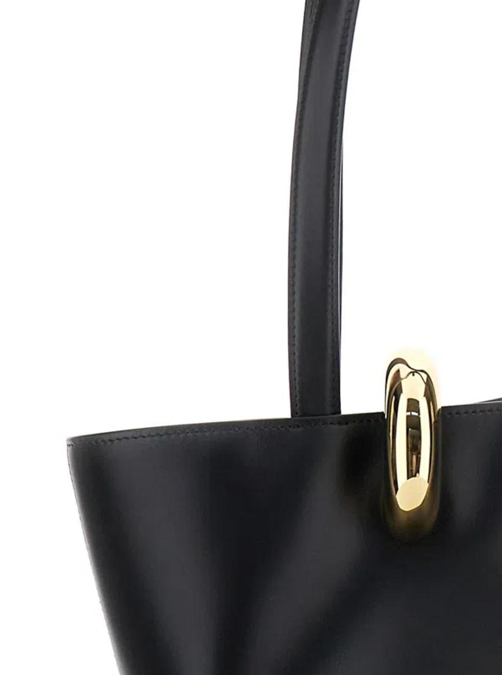 JACQUEMUS The Medium Bambola Asymmetric Leather Bucket Bag In Black 990 Product Image