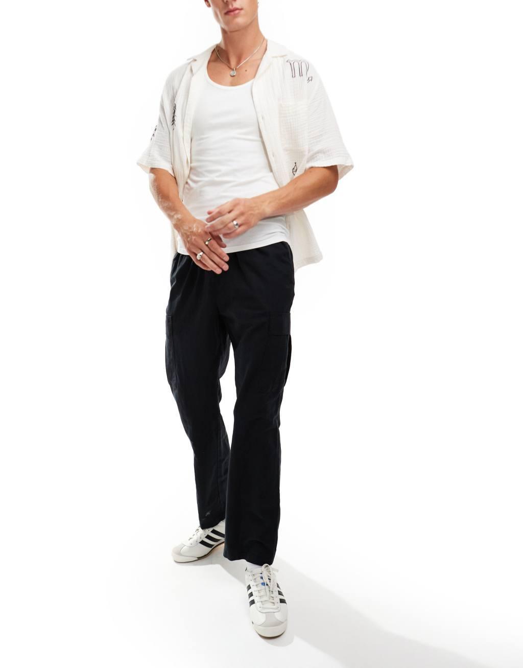 Jack & Jones tapered linen blend pants with cargo pockets in black Product Image