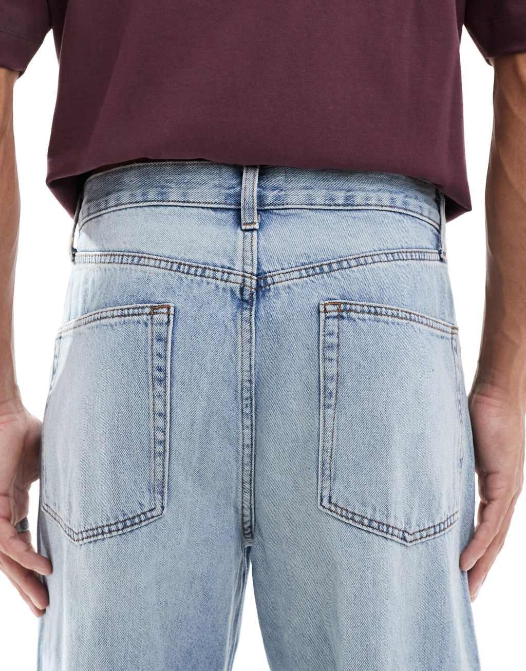 ASOS DESIGN baggy jeans with rips in light wash  Product Image