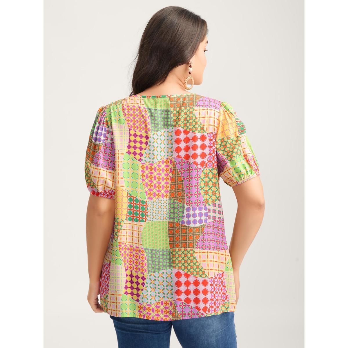 Plus Size Multicolor Vibrant Collage Print Babydoll Top Women Short sleeve Deep V-neck Vacation Blouses BloomChic 18-20/2X Product Image