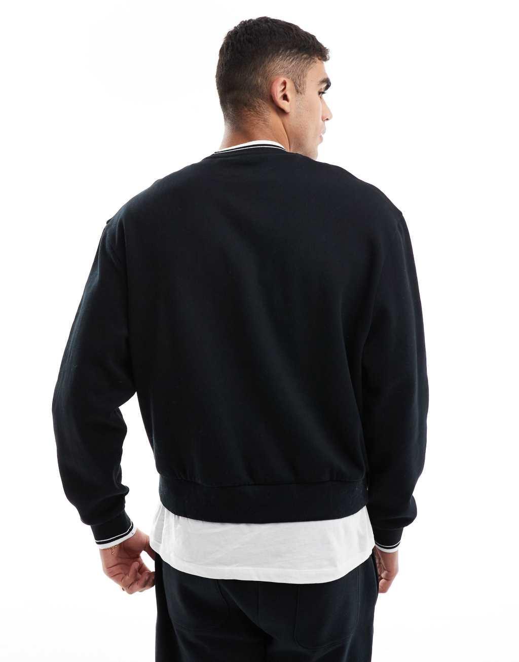 ASOS DESIGN oversized sweatshirt with chest embroidery and tipping in black Product Image