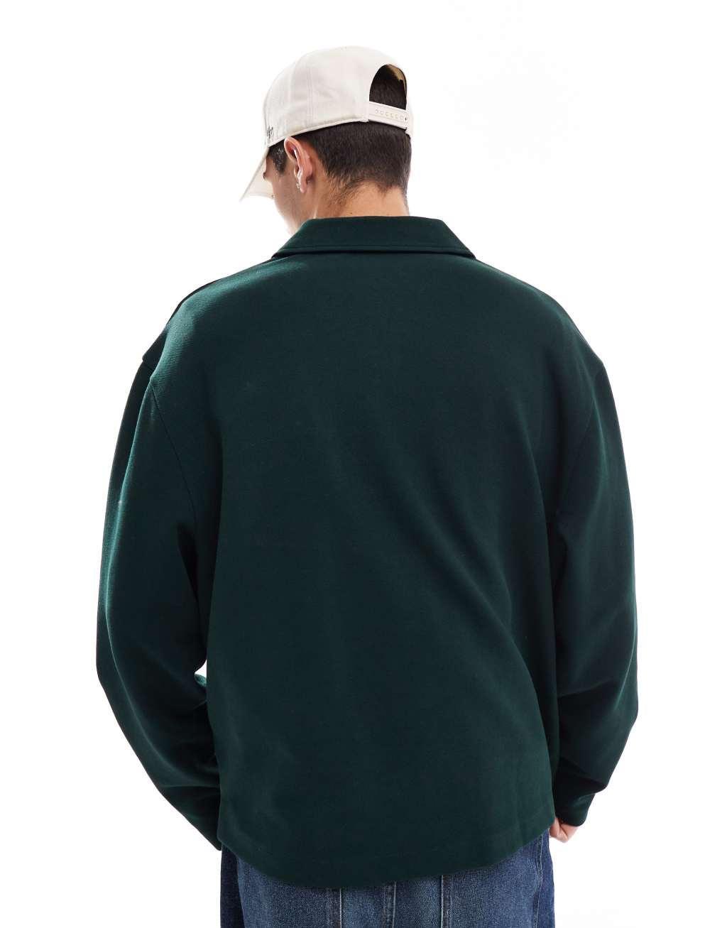 ASOS DESIGN oversized polo in textured jersey with pocket print in dark green Product Image