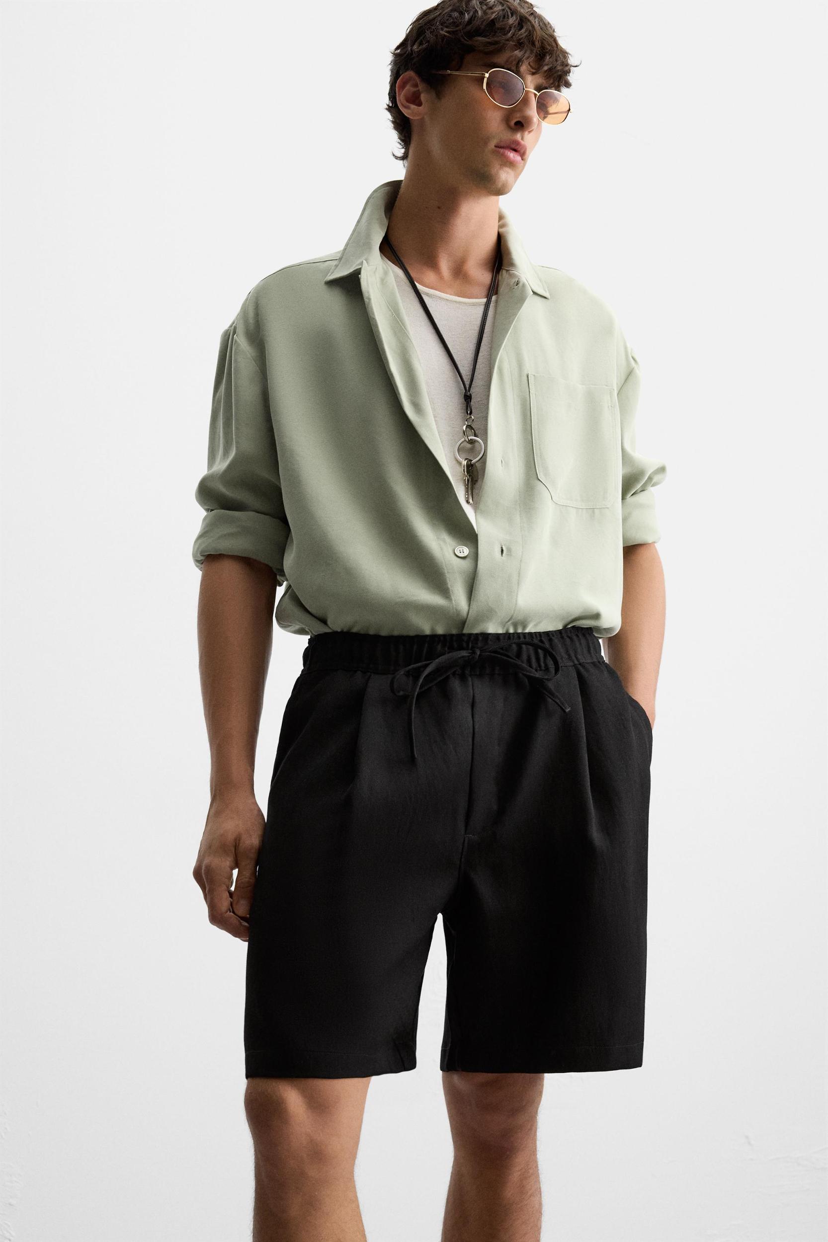 PLEATED FLOWY SHORTS Product Image