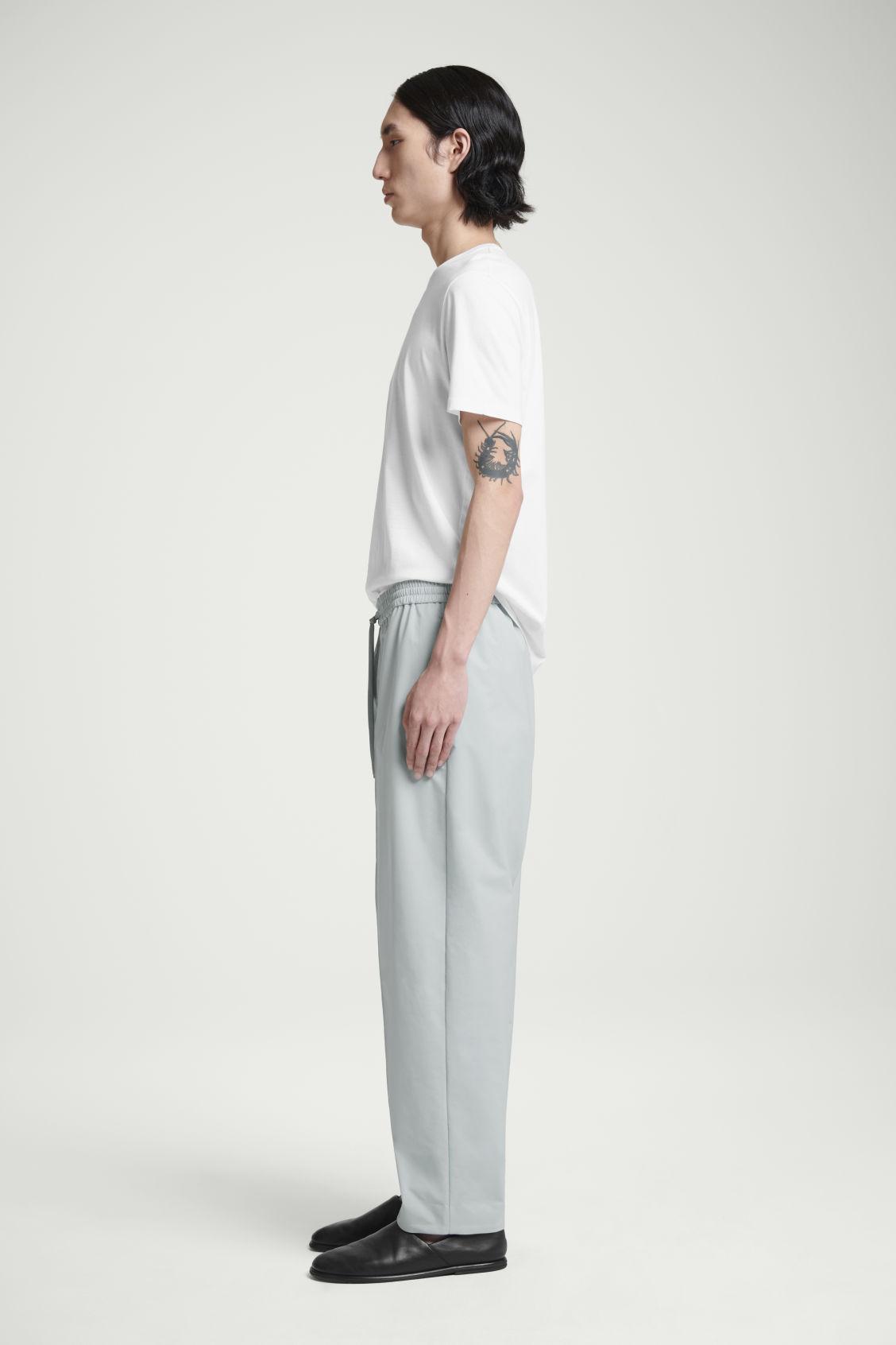 PINTUCKED TAPERED TRACK PANTS Product Image