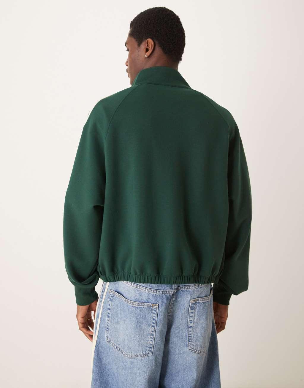 ASOS DESIGN oversized cropped track jacket with raglan sleeve in dark green Product Image