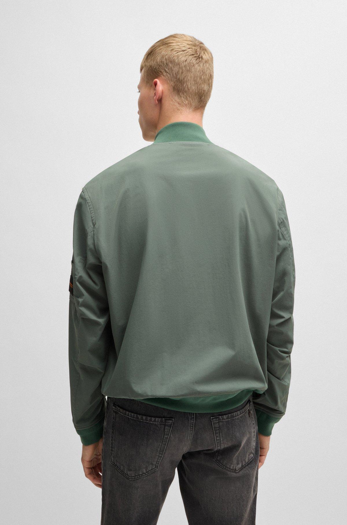 Water-repellent jacket with zipped sleeve pocket Product Image