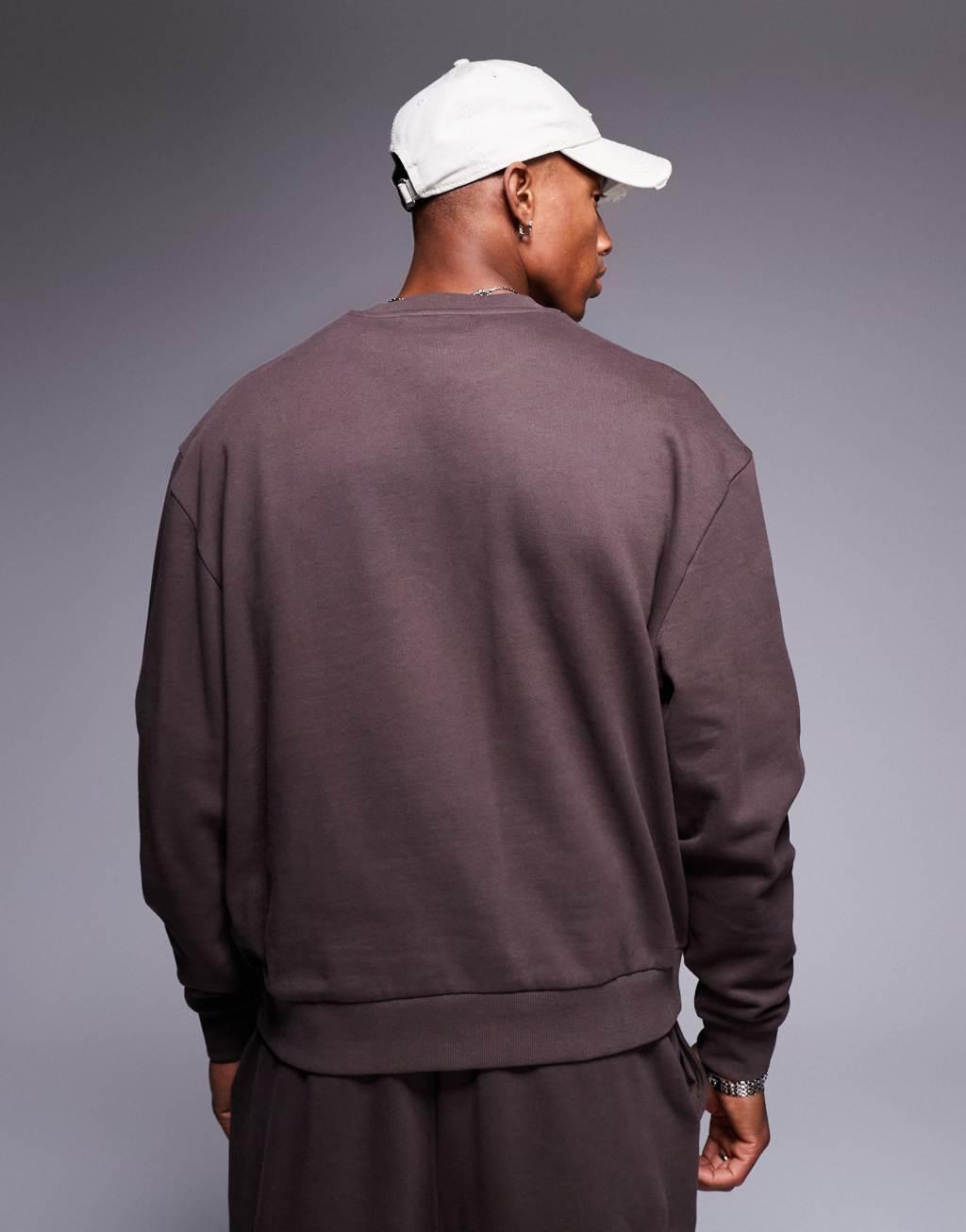 ASOS DESIGN boxy oversized sweatshirt with 1994 print in brown Product Image