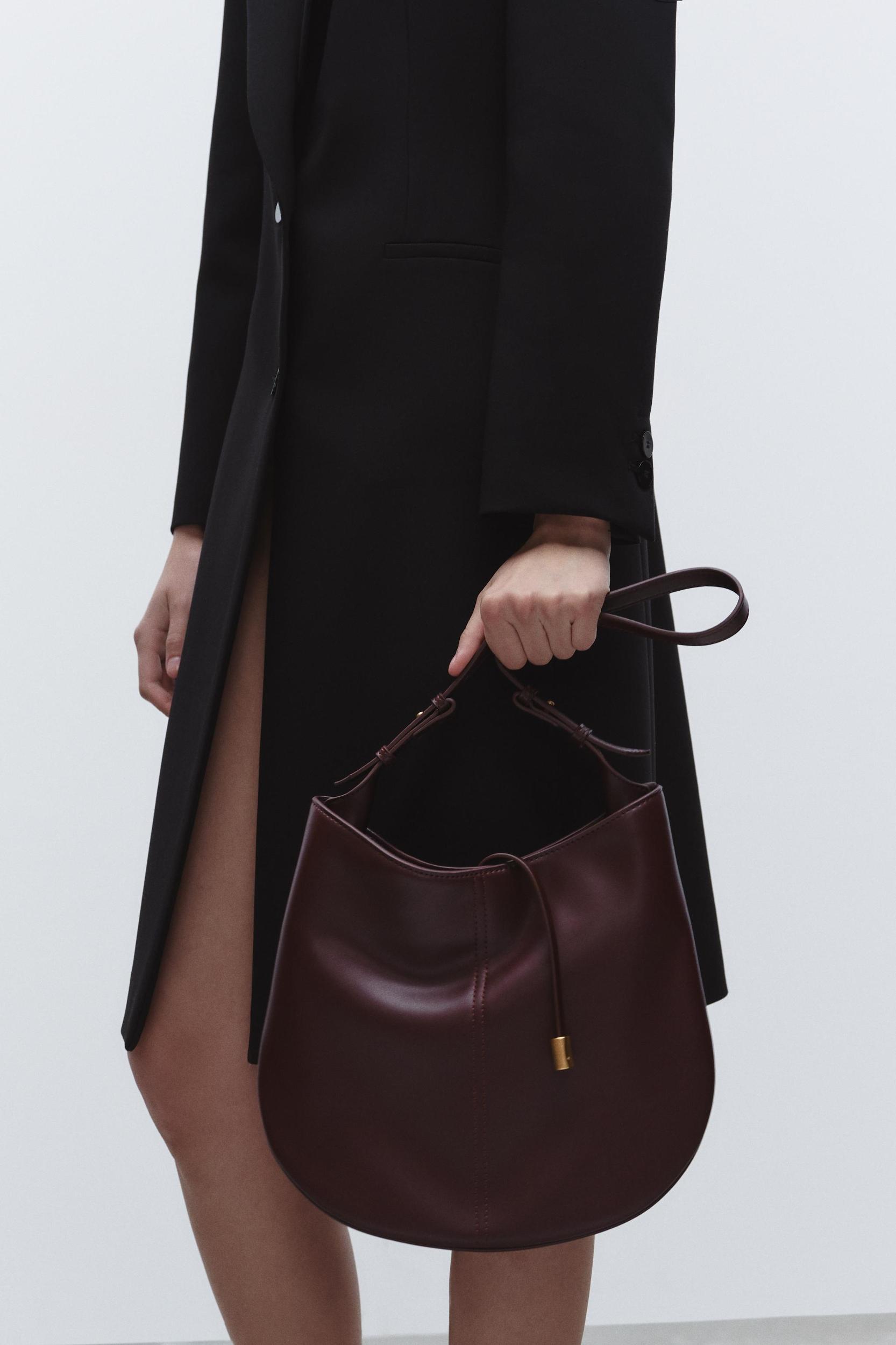 BUCKET BAG WITH PENDANT DETAIL Product Image