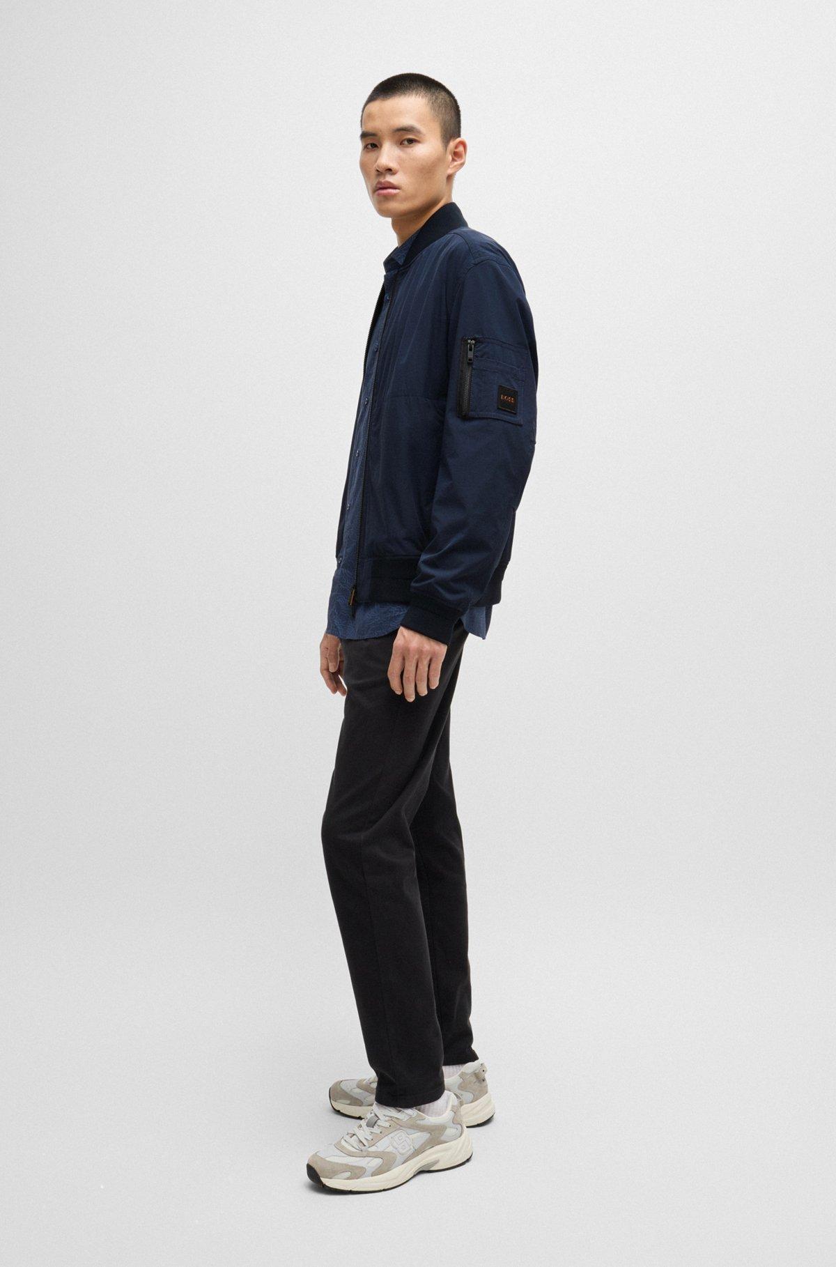 Water-repellent jacket with zipped sleeve pocket Product Image