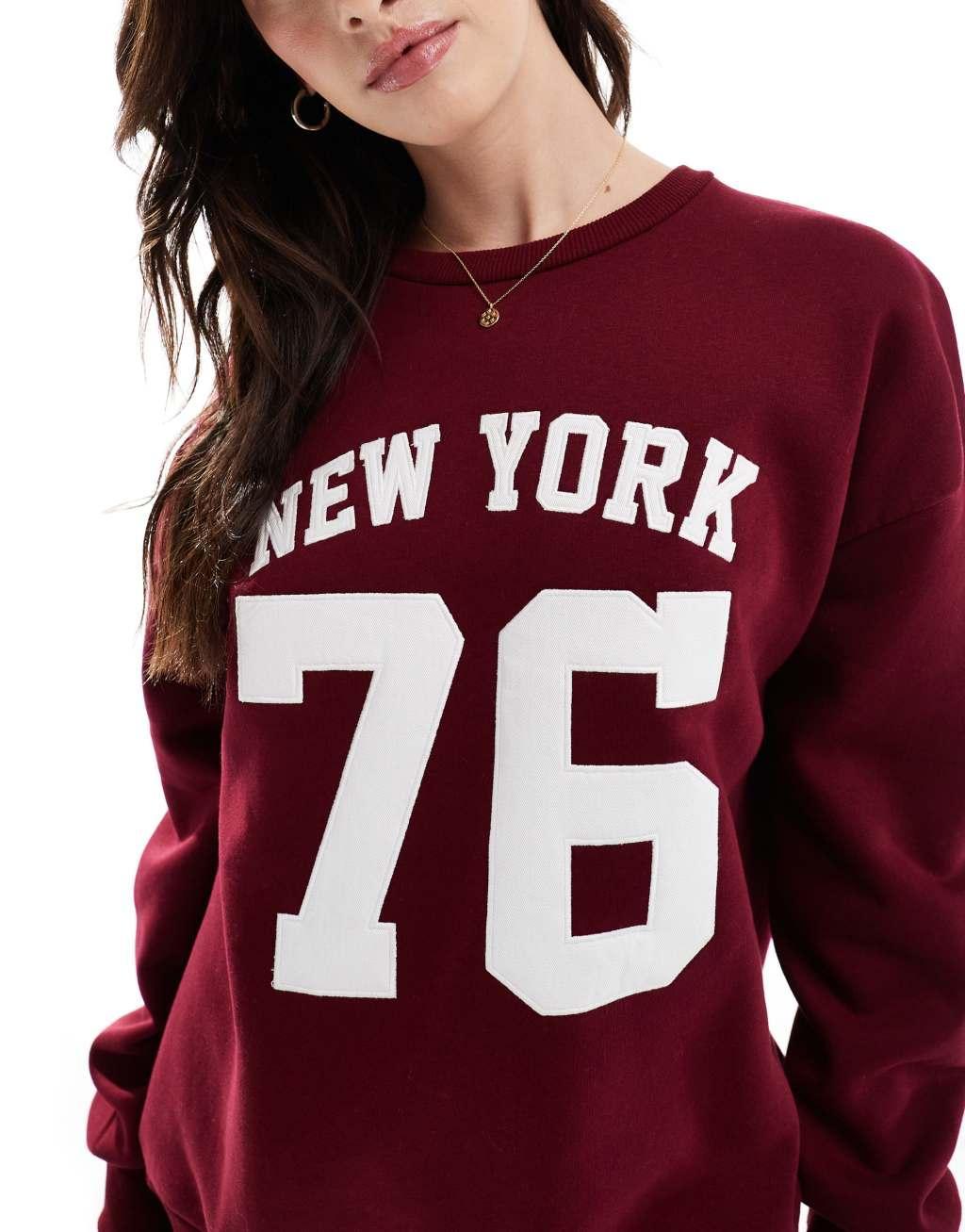 Stradivarius NY slogan sweatshirt in burgundy Product Image