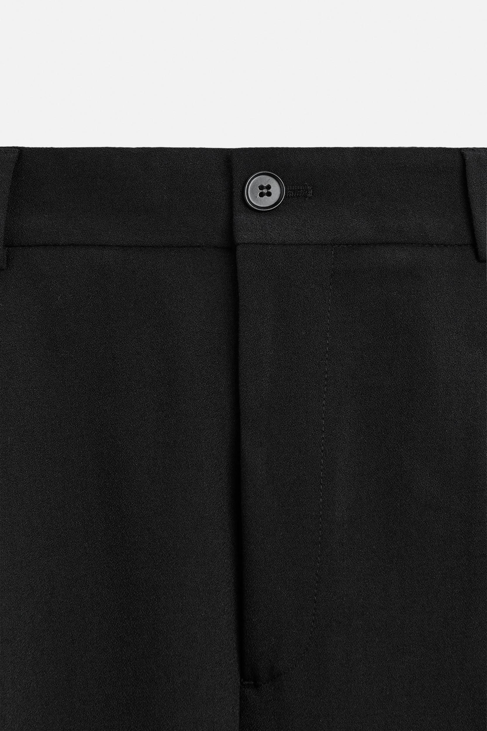RELAXED FIT PLEATED PANTS Product Image