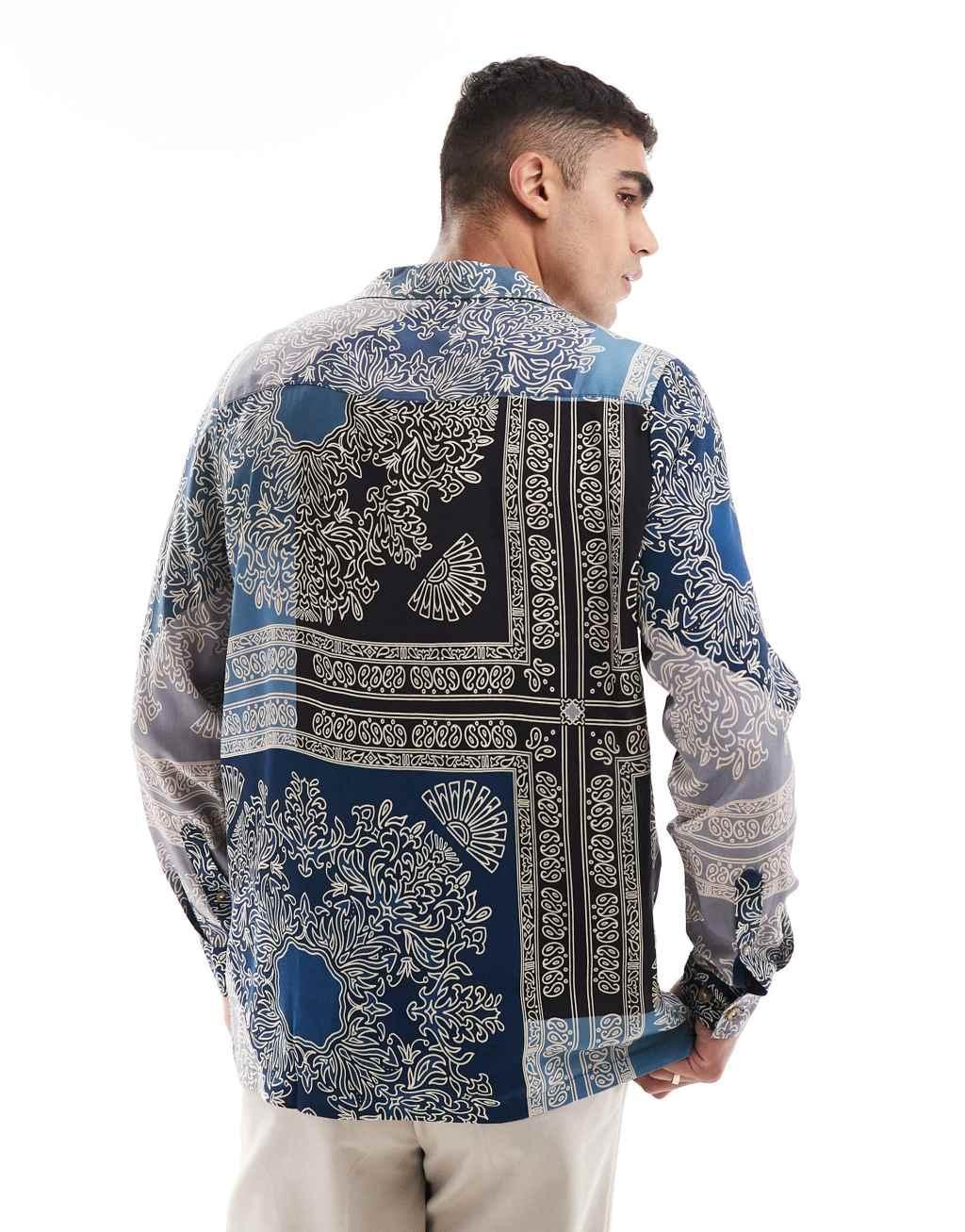 ASOS DESIGN relaxed deep revere shirt in spliced bandana print in blue  Product Image