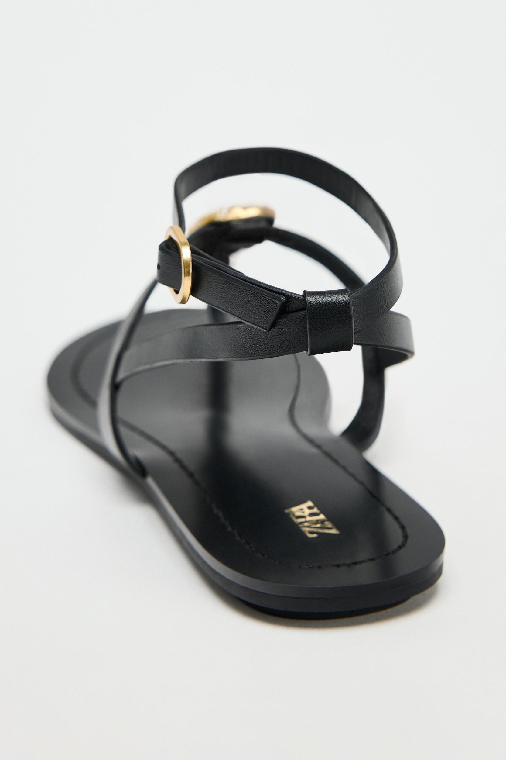 FLAT SANDALS WITH METALLIC PIECE Product Image