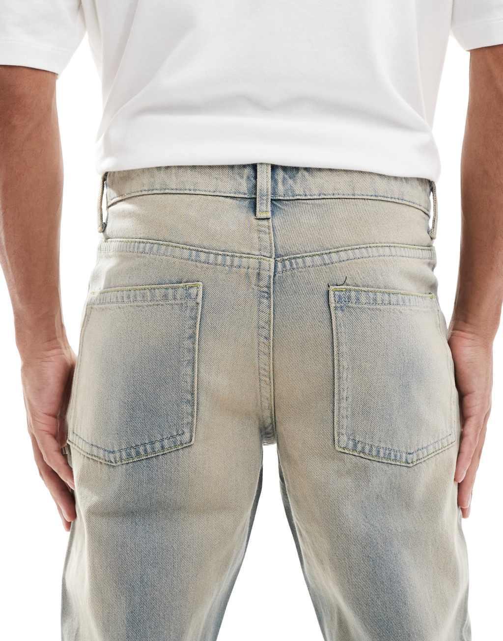 ASOS DESIGN tapered jeans in light wash with tint Product Image