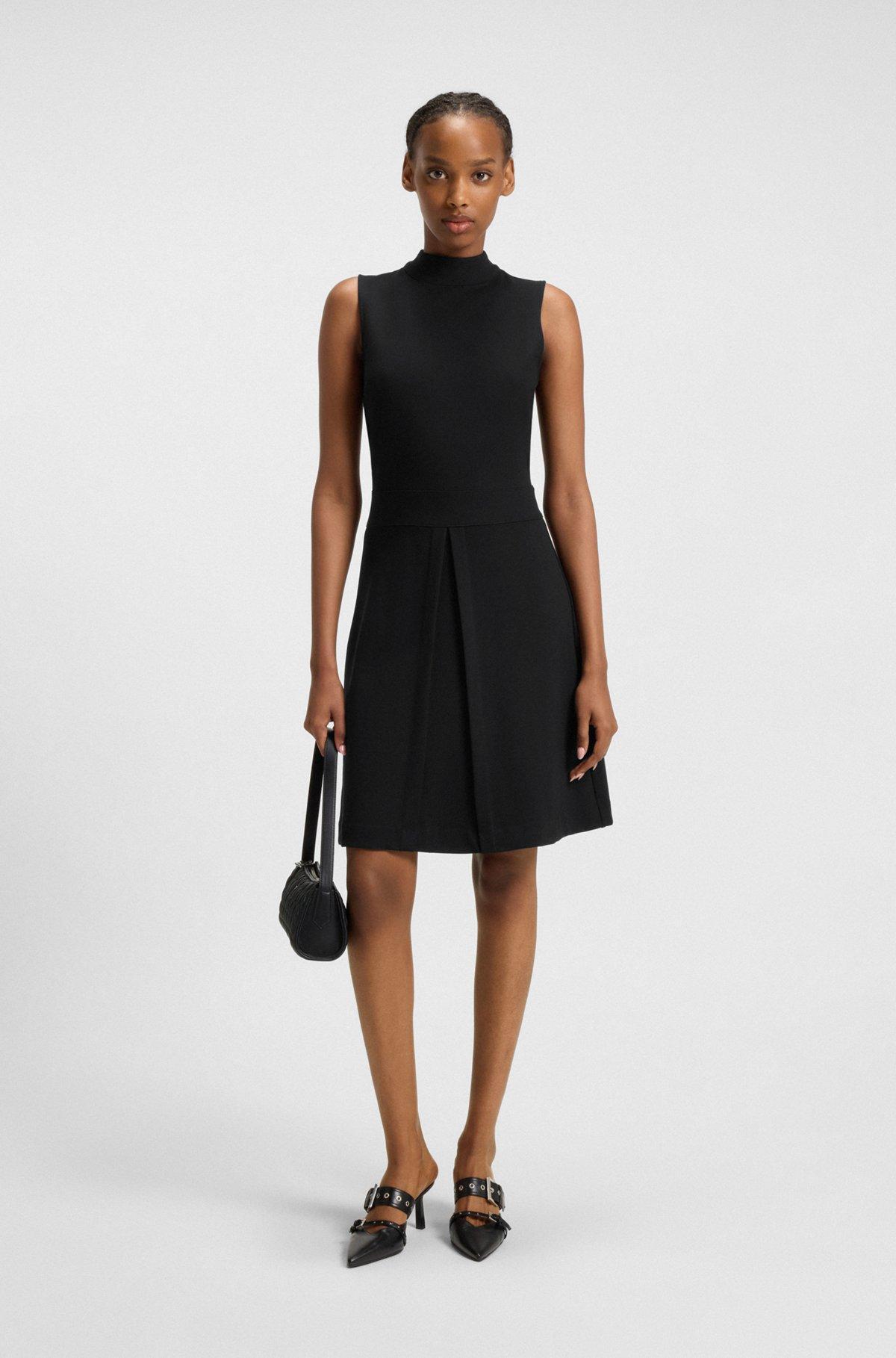 Sleeveless knitted dress with pleated skirt Product Image