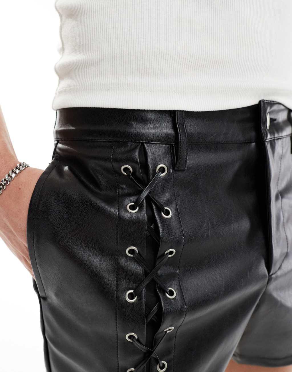 ASOS DESIGN slim leather look shorts with lace up details in black Product Image