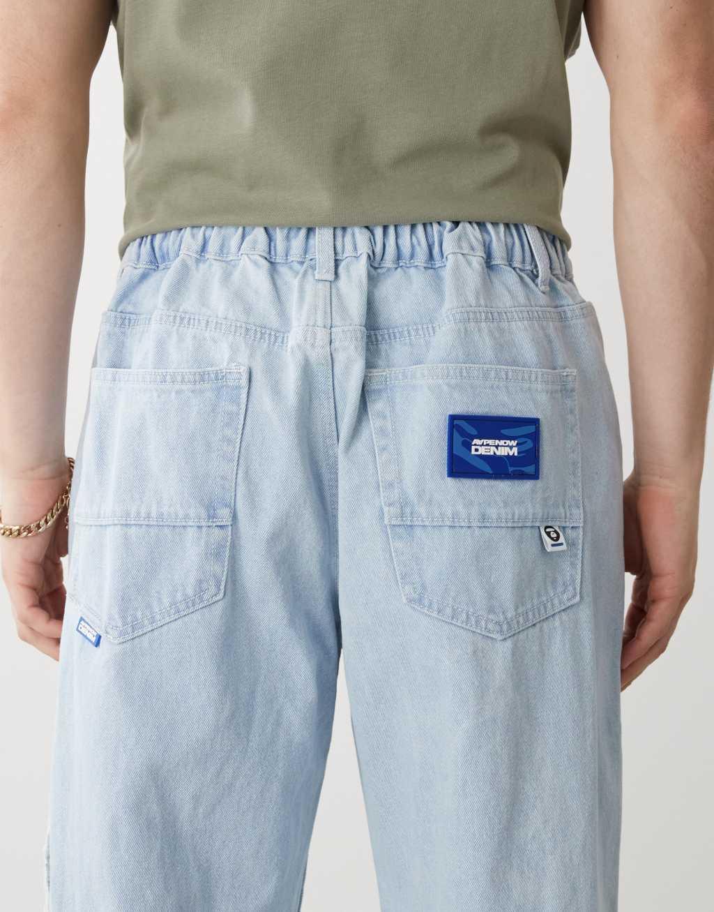 AAPE by A Bathing Ape loose fit logo jeans in light wash Product Image