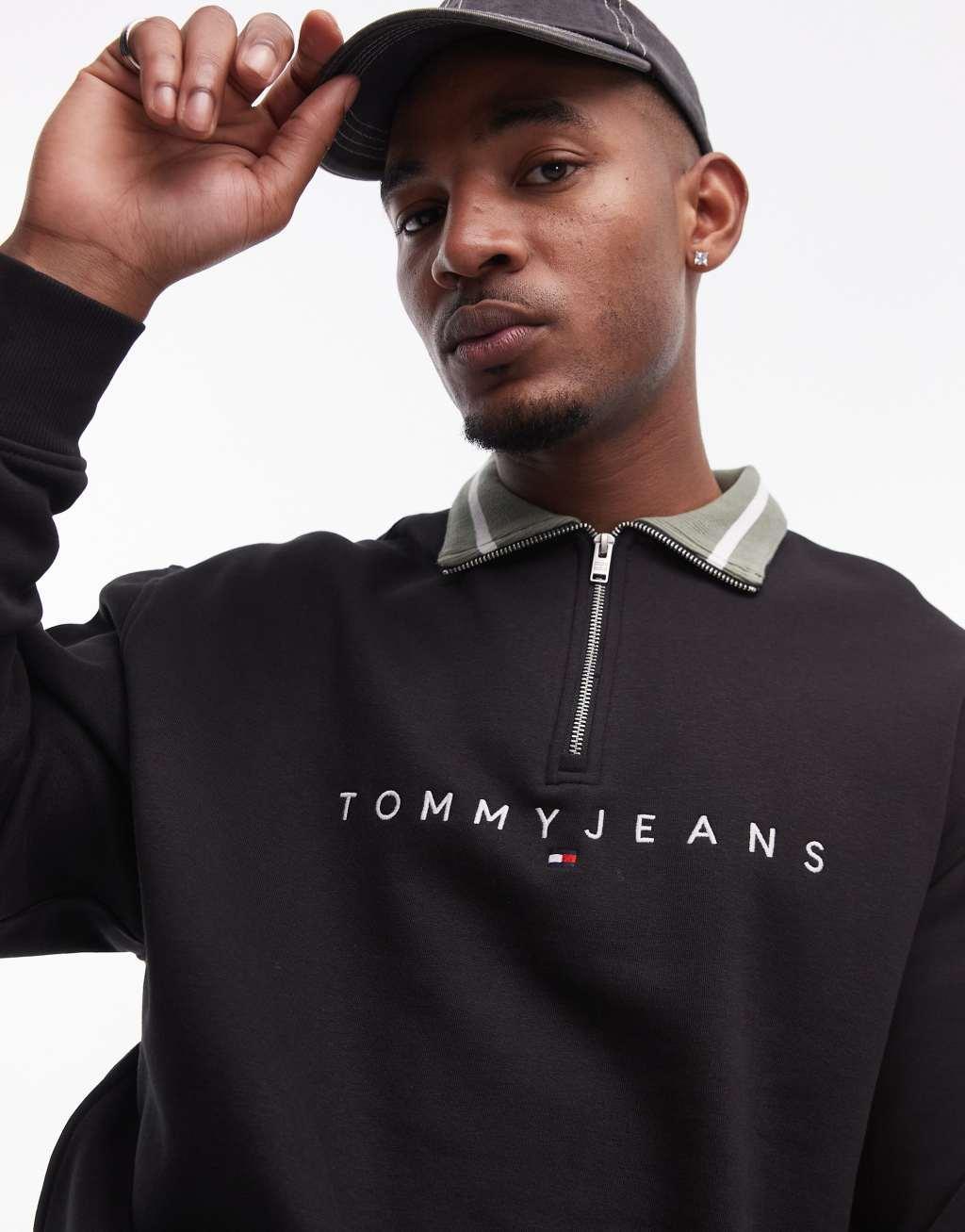 Tommy Jeans linear logo half zip sweatshirt in black Product Image