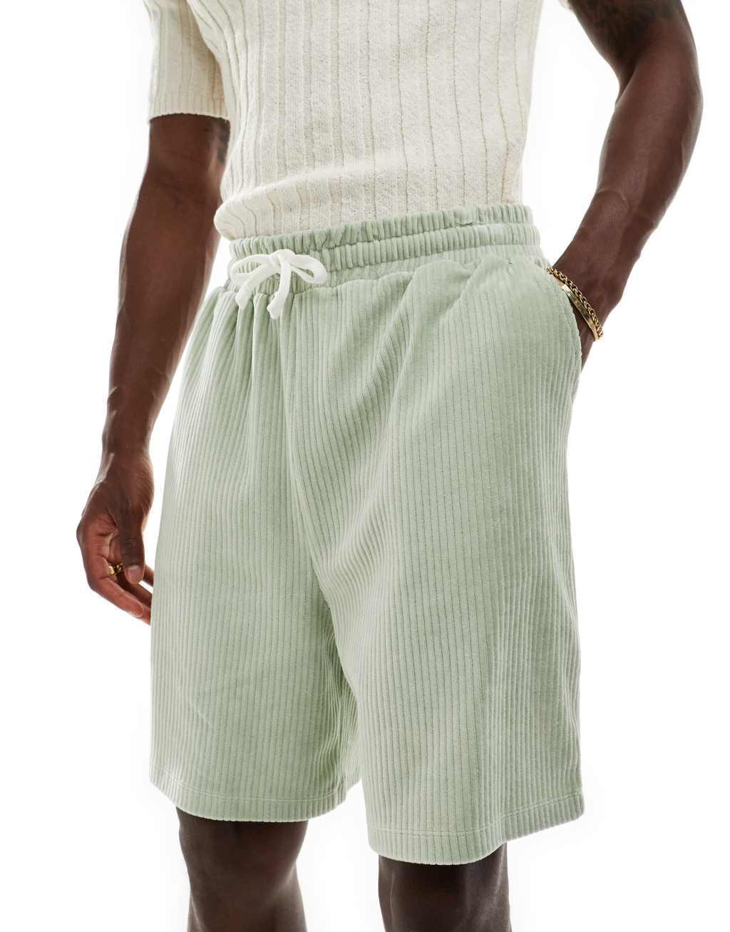 ASOS DESIGN oversized ribbed velour shorts in light green Product Image