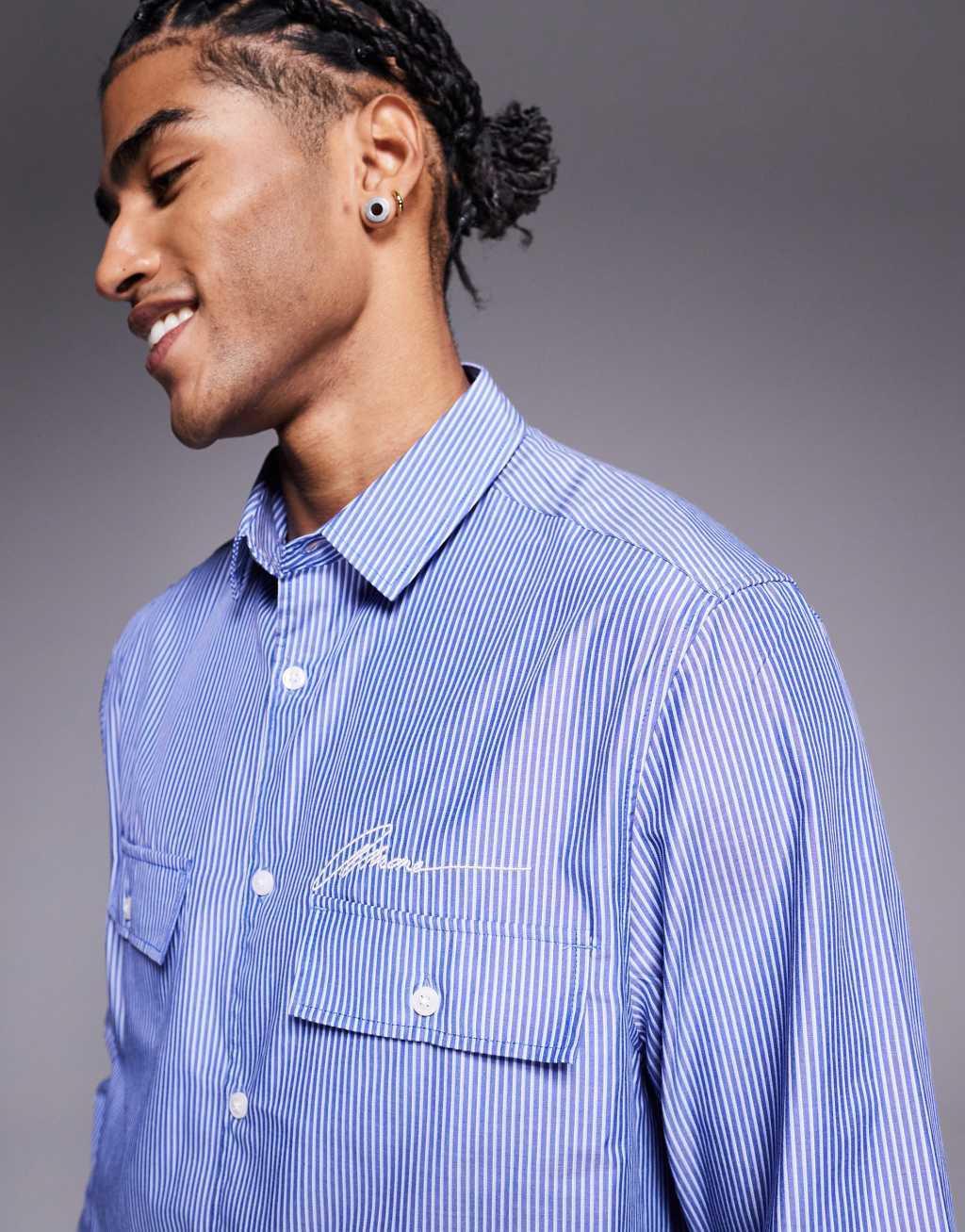 ASOS DESIGN boxy striped shirt with chest embroidery in blue Product Image