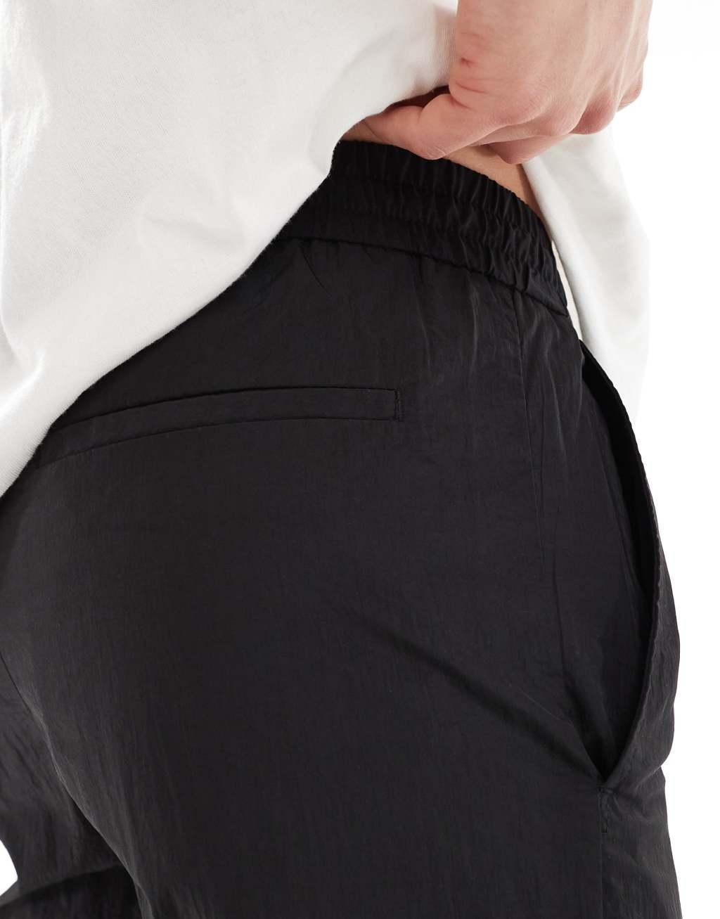 ONLY & SONS loose fit tech pants in black Product Image