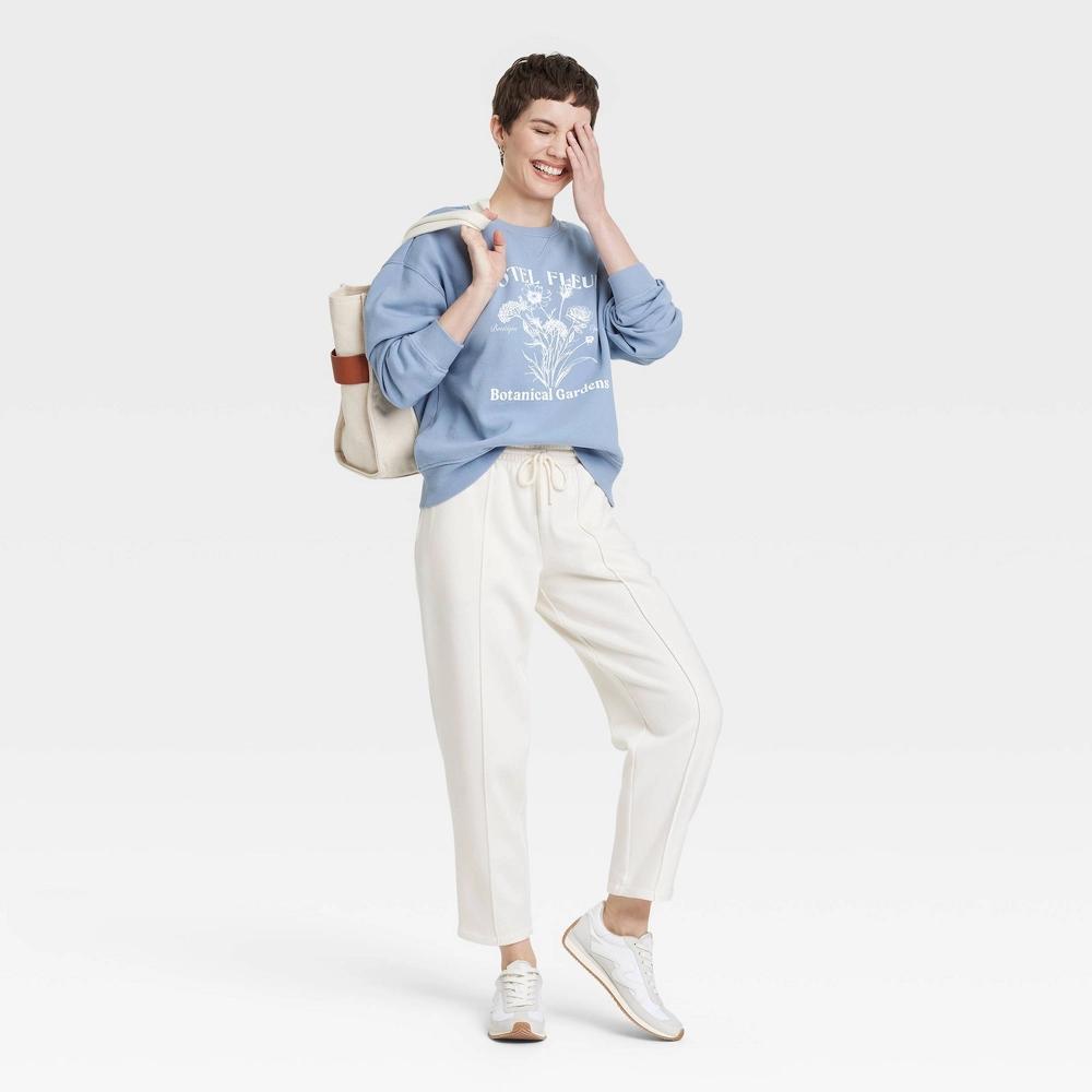 Womens Leisure Studio Oversized Graphic Sweatshirt - Universal Thread Blue Letters S: Cotton Blend, Crew Neck, Long Sleeve Product Image