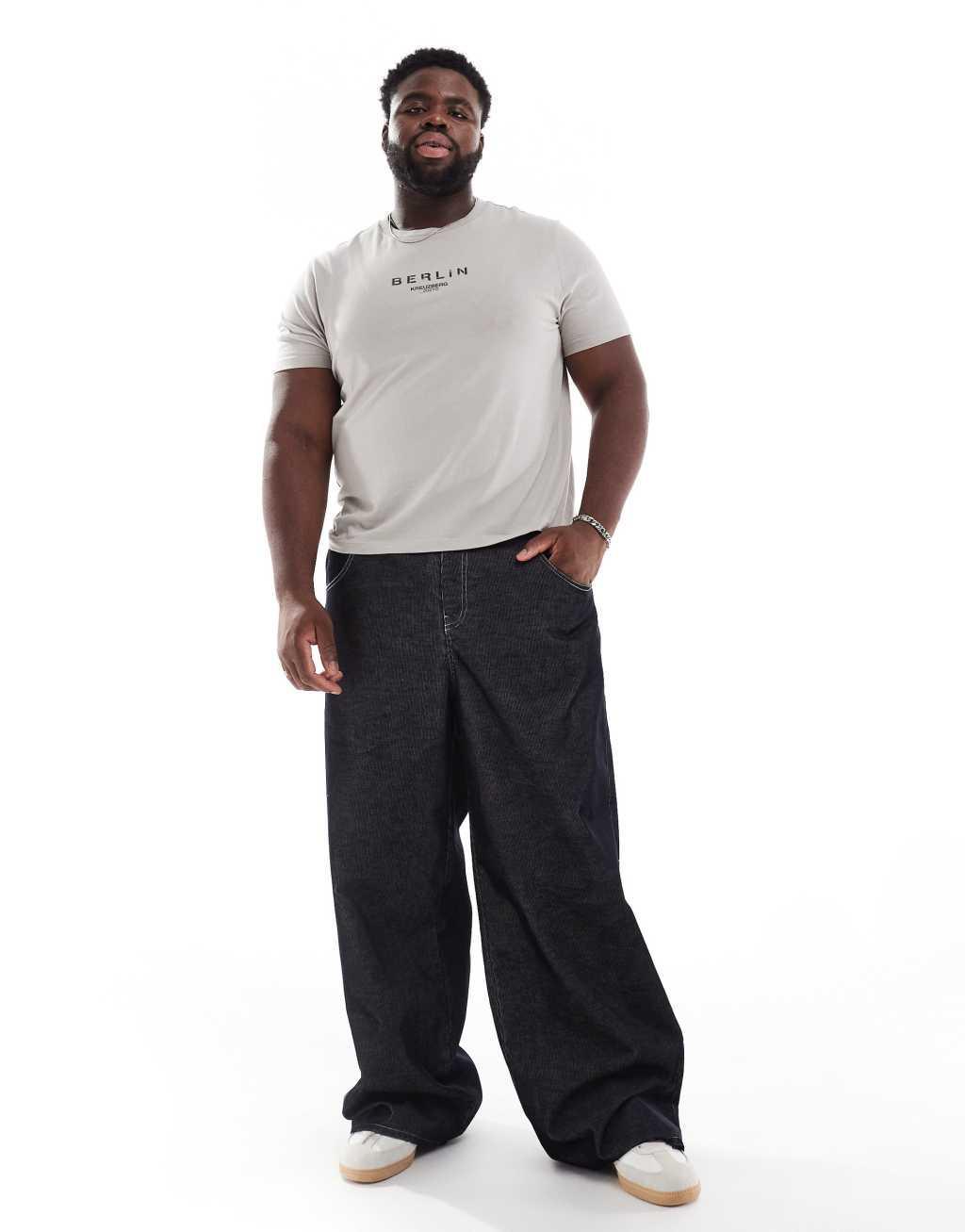 ASOS DESIGN super baggy corduroy pants with contrast stitch in black Product Image
