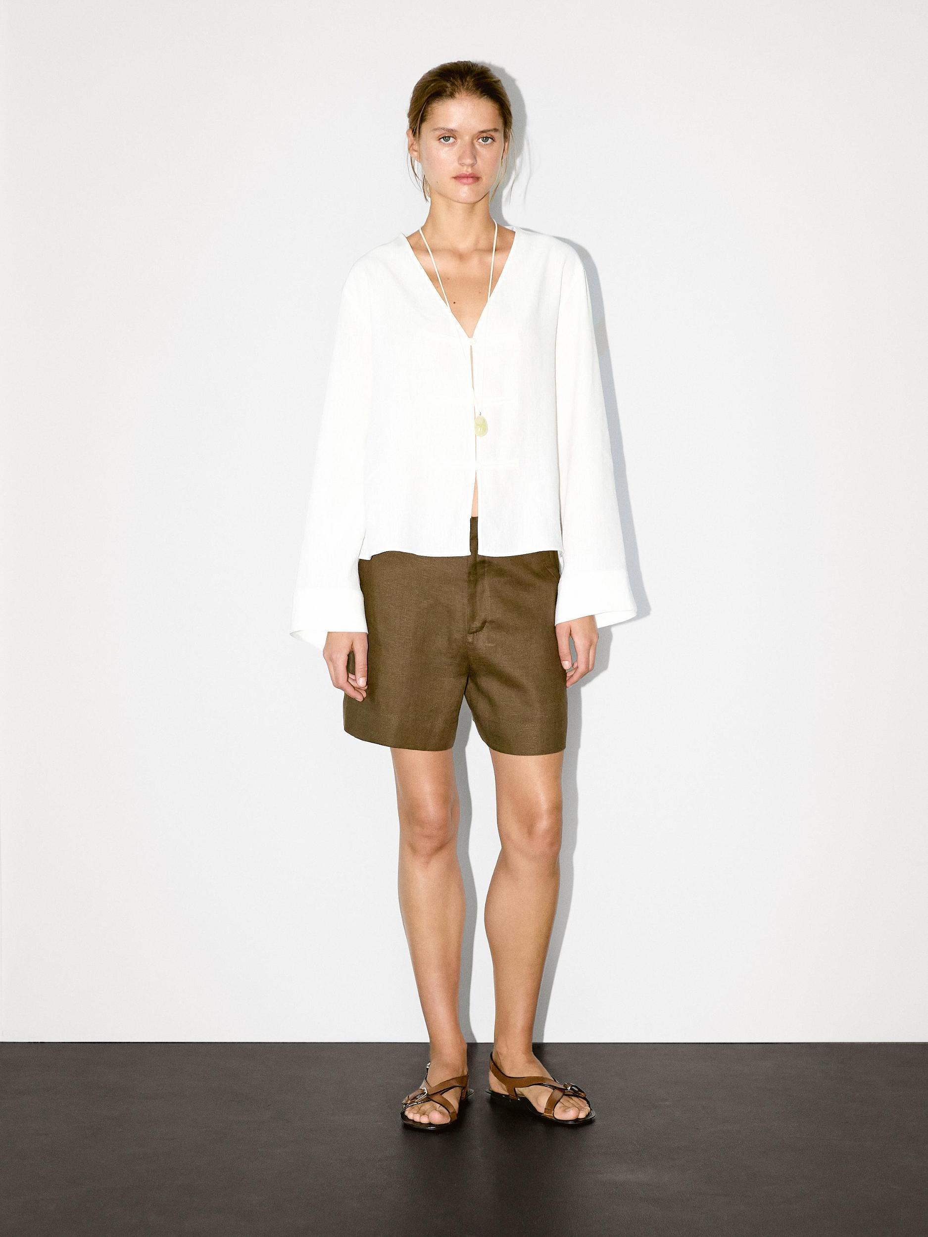 Flowing linen blend blouse with V-neckline Product Image