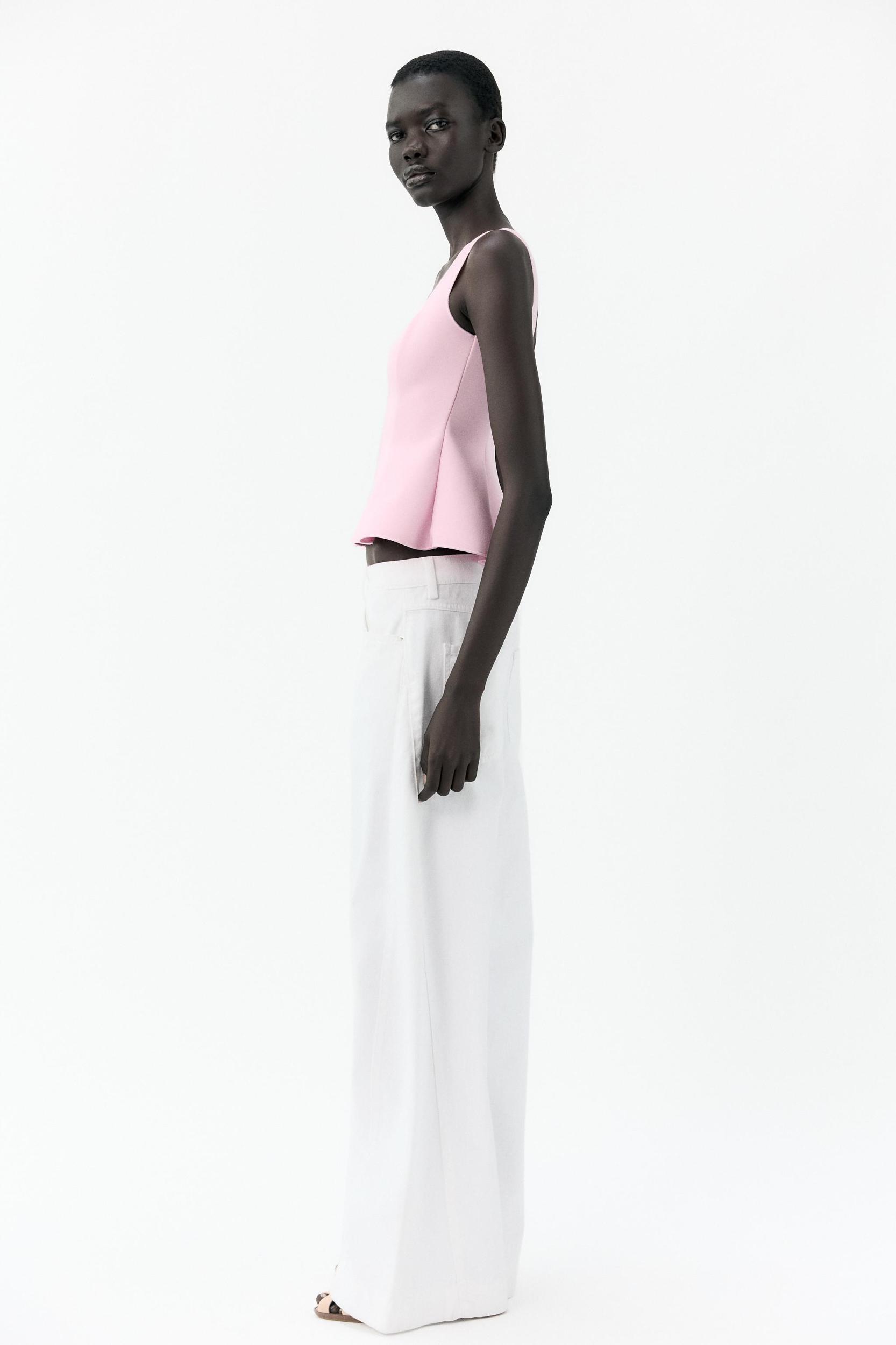 STRETCH PEPLUM VEST TOP Product Image