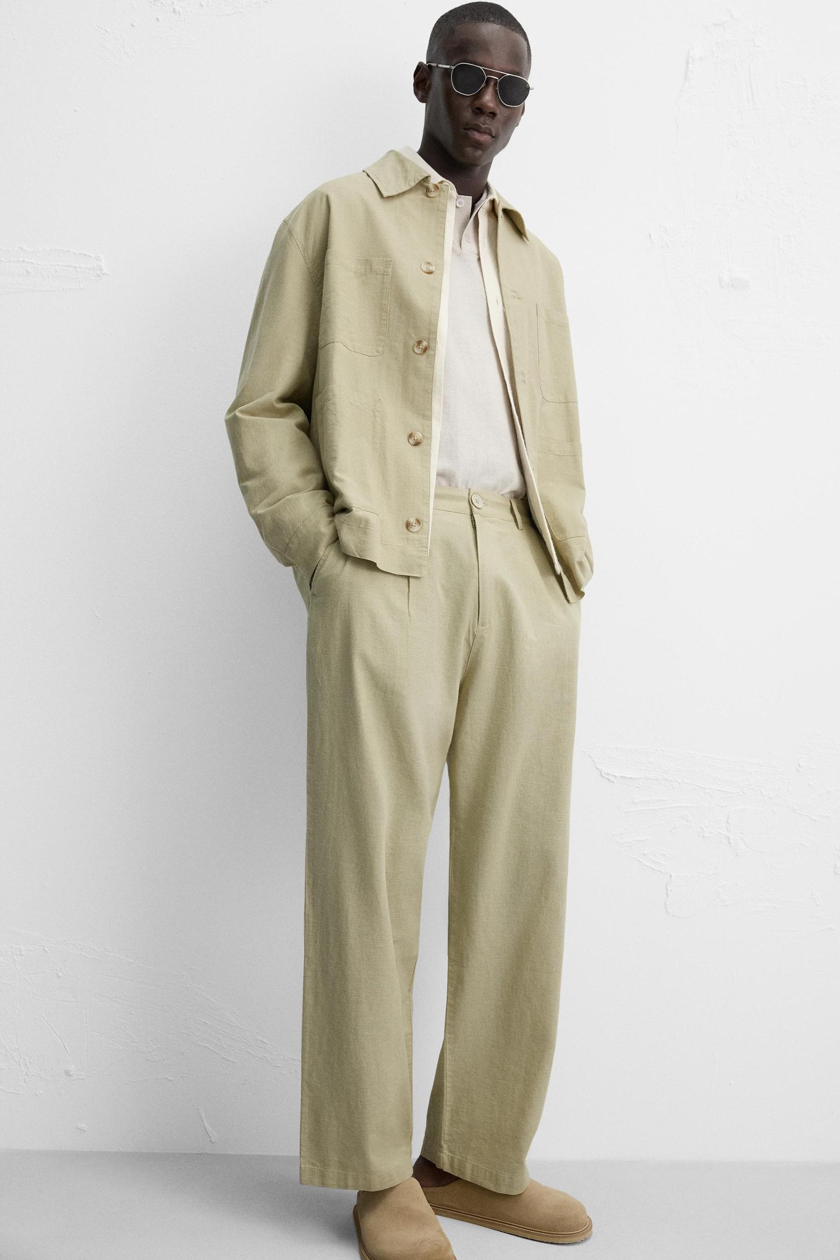 RELAXED FIT PLEATED PANTS Product Image