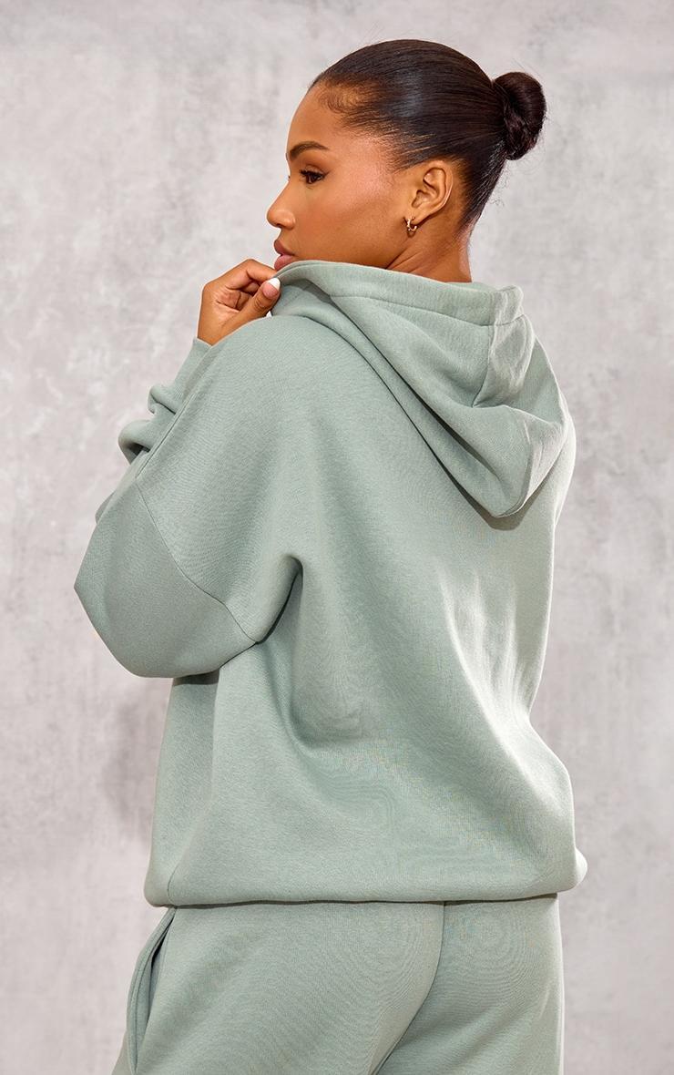 PRETTYLITTLETHING Sage Athletics Club Embossed Graphic Oversized Hoodie Product Image