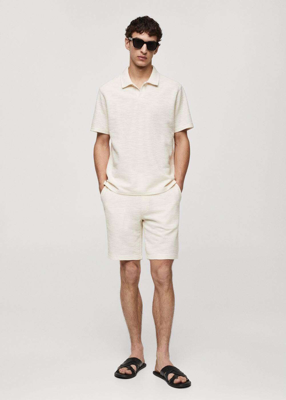 Regular-fit textured knitted polo shirt - Men | MANGO USA Product Image