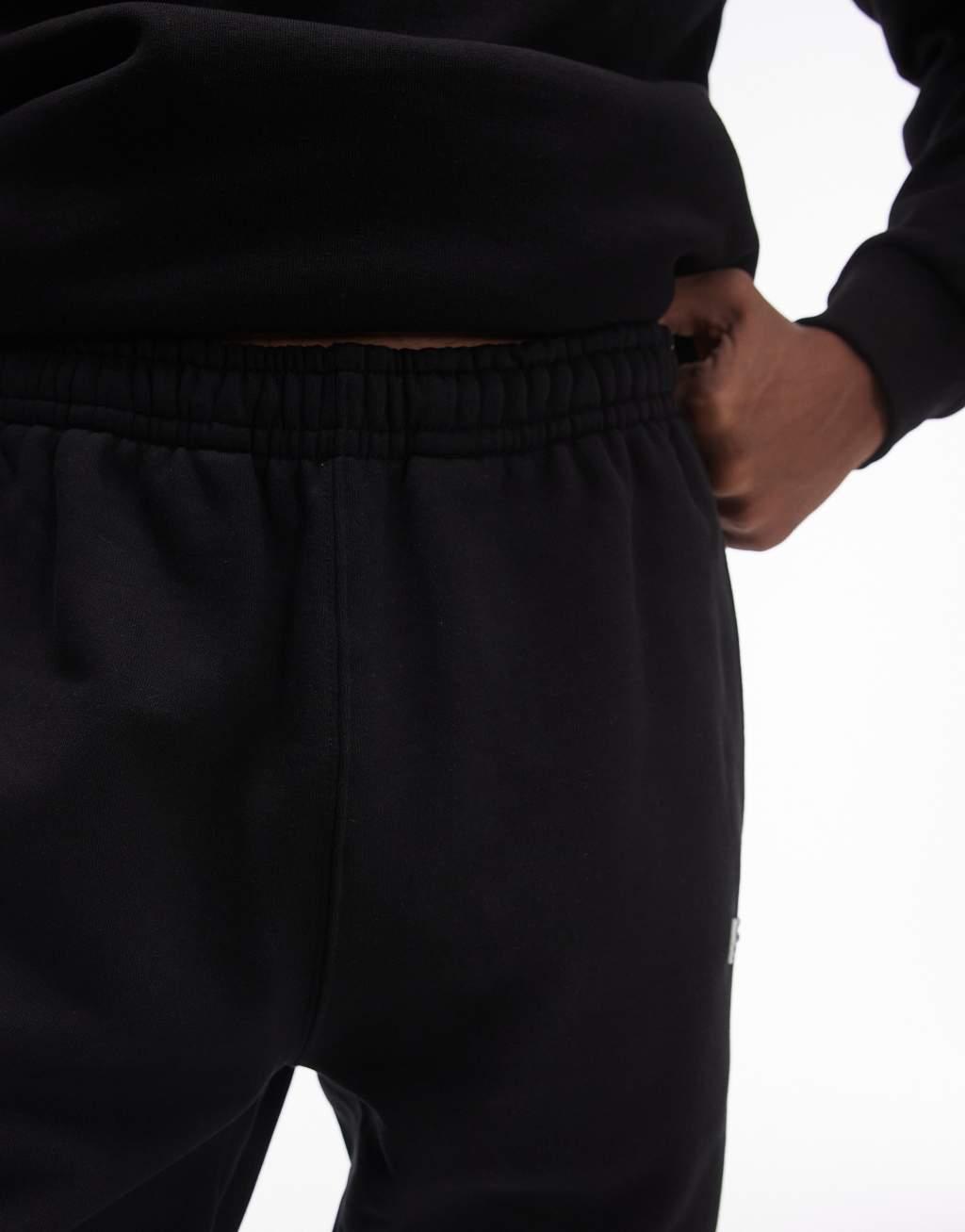 Lacoste logo stripe sweatpants in black  Product Image