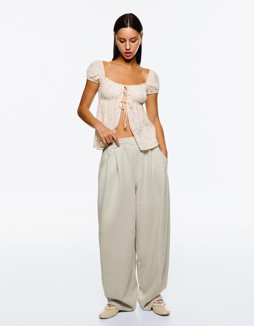 Textured printed top with bows Product Image