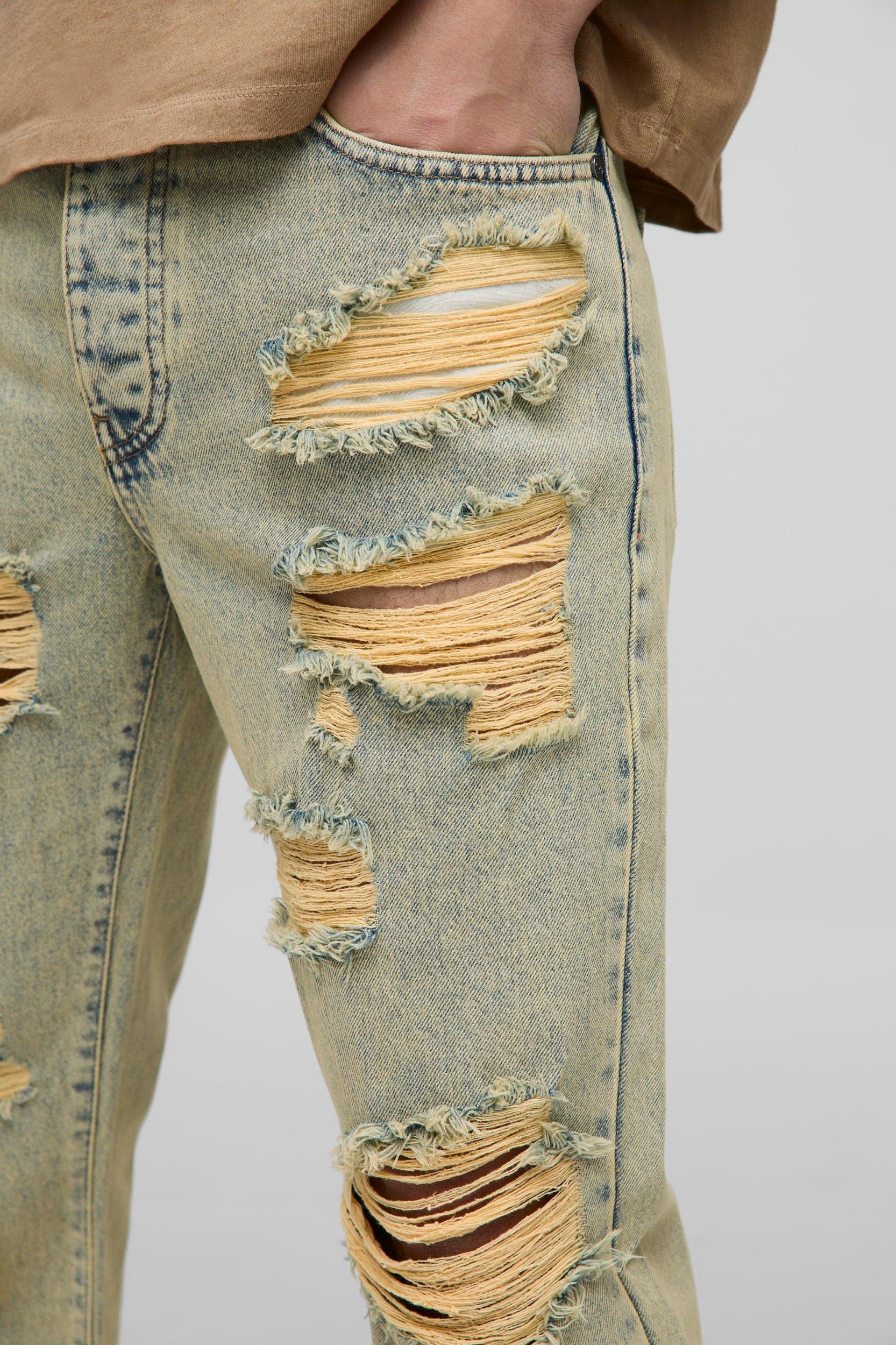 Slim Flared Knee Ripped Bleach Washed Jeans | boohooMAN USA Product Image