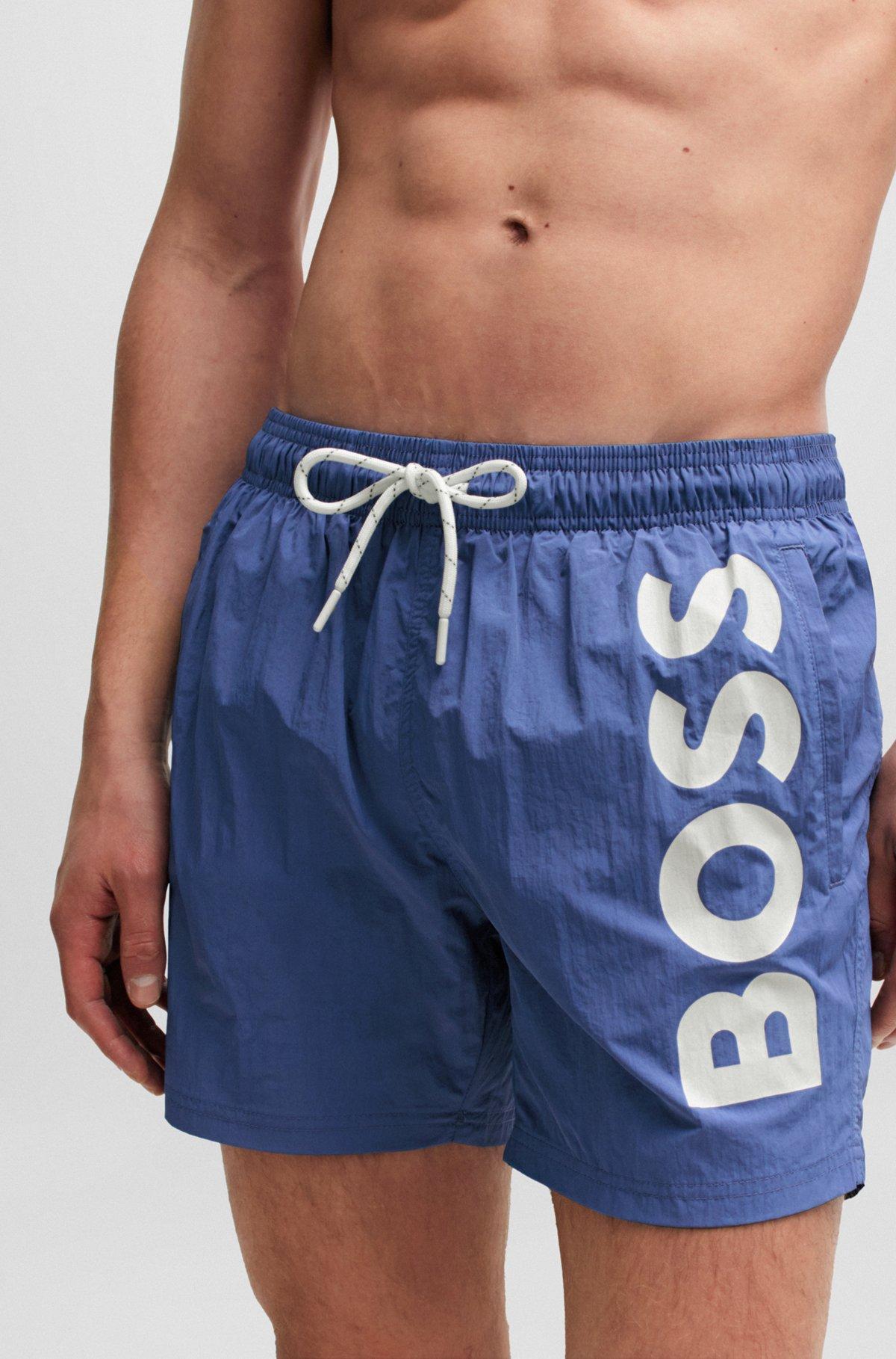 Quick-dry swim shorts with large logo print Product Image