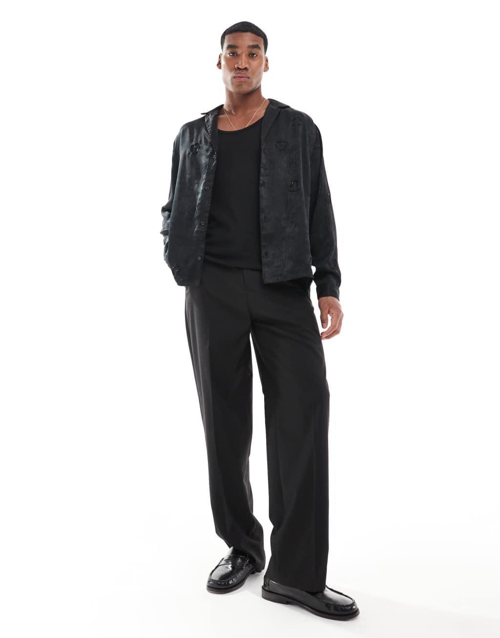 ASOS DESIGN deep camp collar satin shirt with heart embellishment in black Product Image